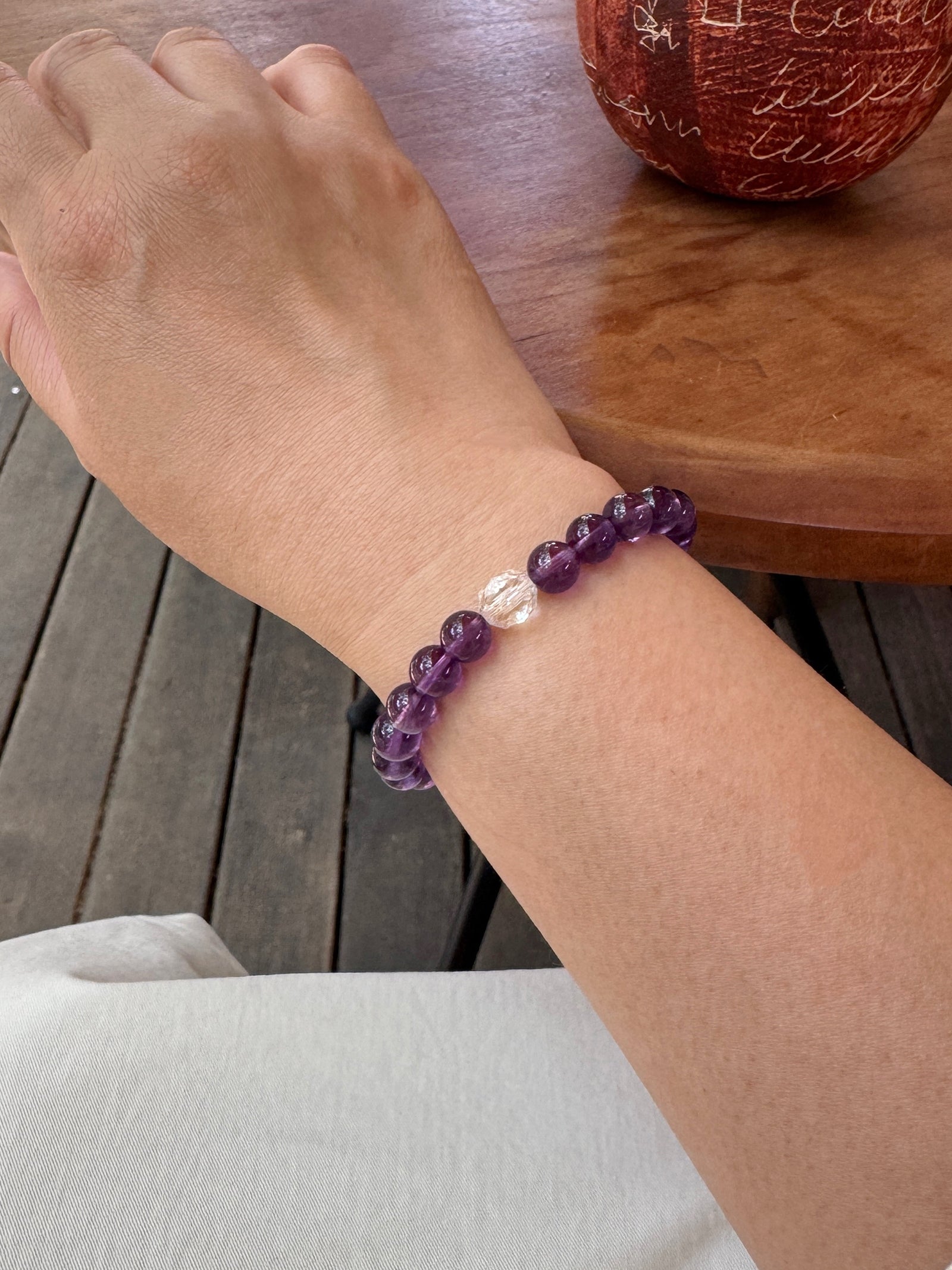Amethyst crystal bracelet worn on wrist close-up for intuition and clarity
