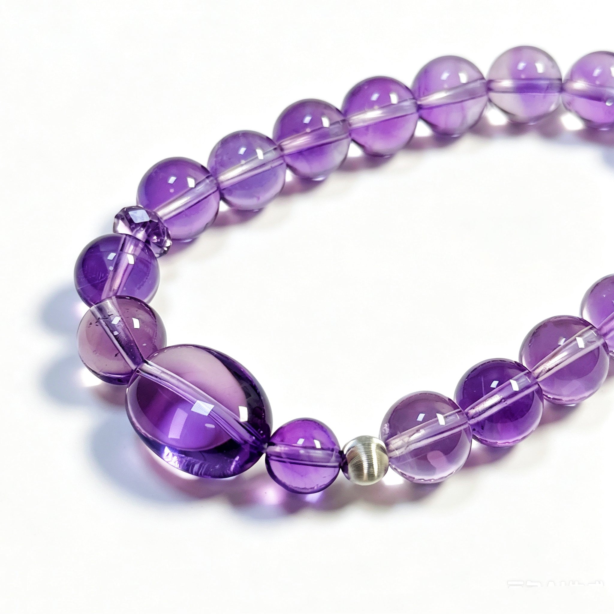 Close-up detail of Amethyst crystal bracelet showing natural texture for inner clarity and intuition