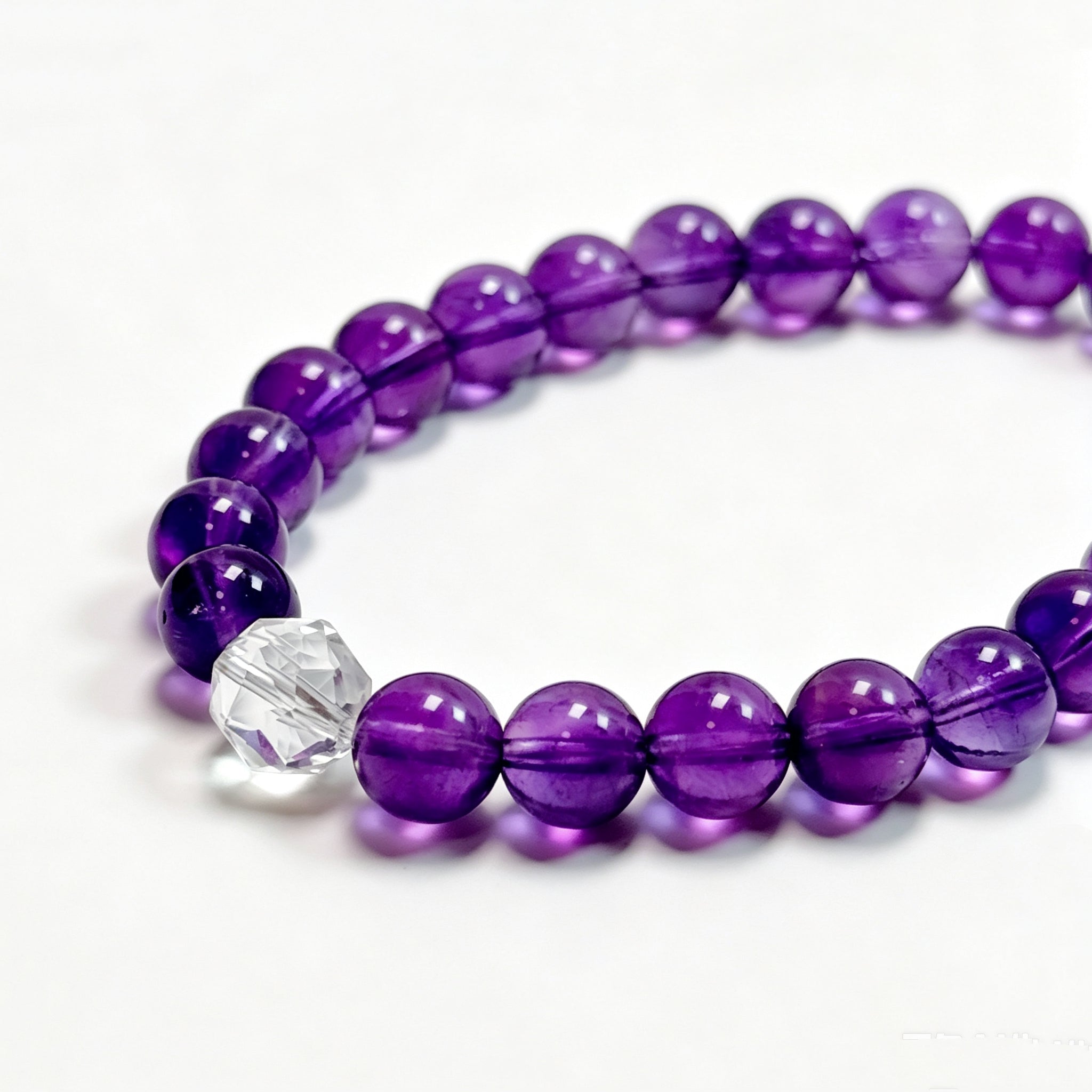 Close-up detail of Amethyst crystal bracelet showing natural texture for inner clarity and intuition