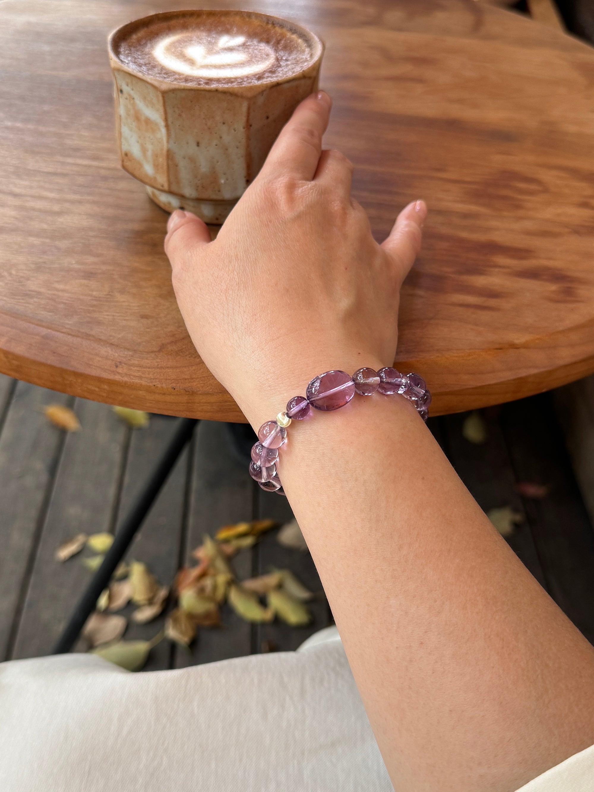 Amethyst crystal bracelet worn on wrist close-up for intuition and clarity