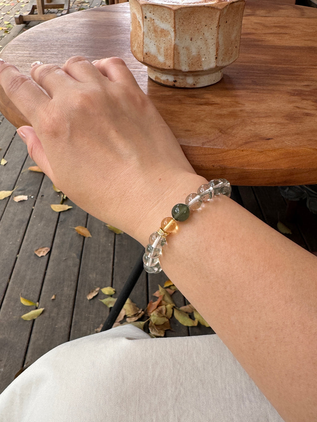 Green Phantom Quartz crystal bracelet worn on wrist close-up for confidence and abundance