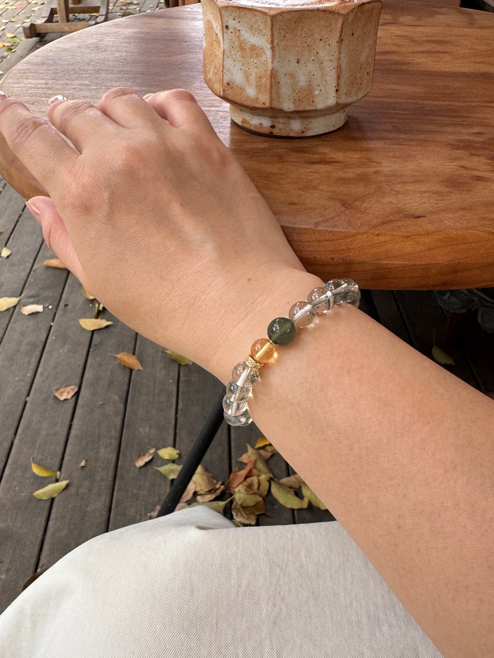 Green Phantom Quartz crystal bracelet worn on wrist close-up for confidence and abundance