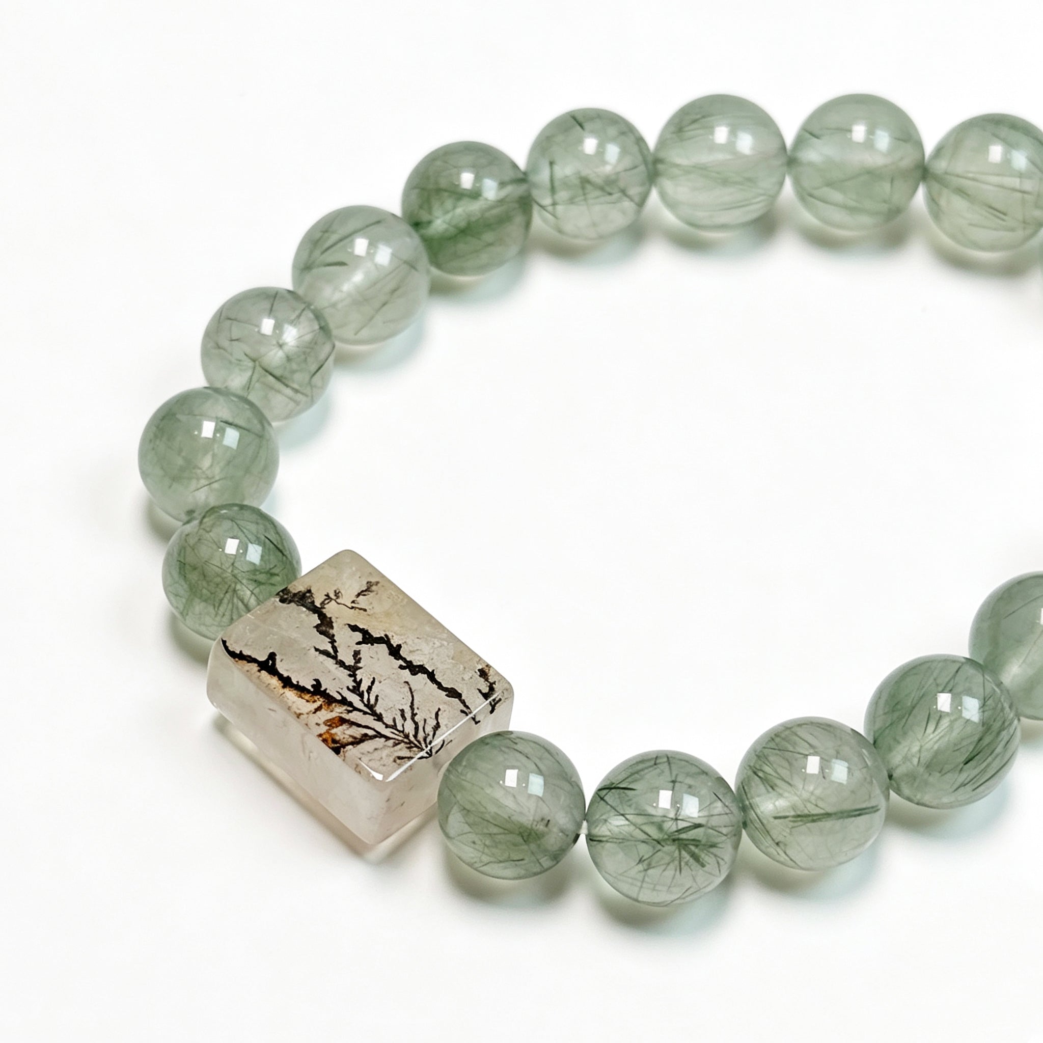 Close-up detail of Green Rutilated Quartz crystal bracelet showing natural stone texture for confidence and abundance
