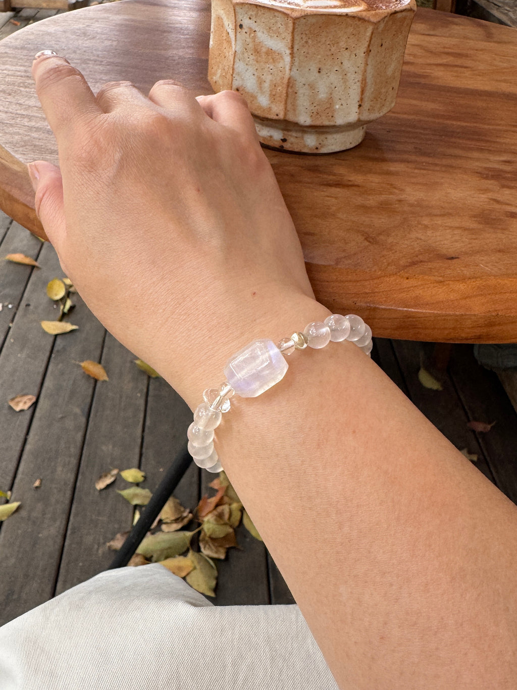 Moonstone crystal bracelet worn on wrist close-up showing size and fit