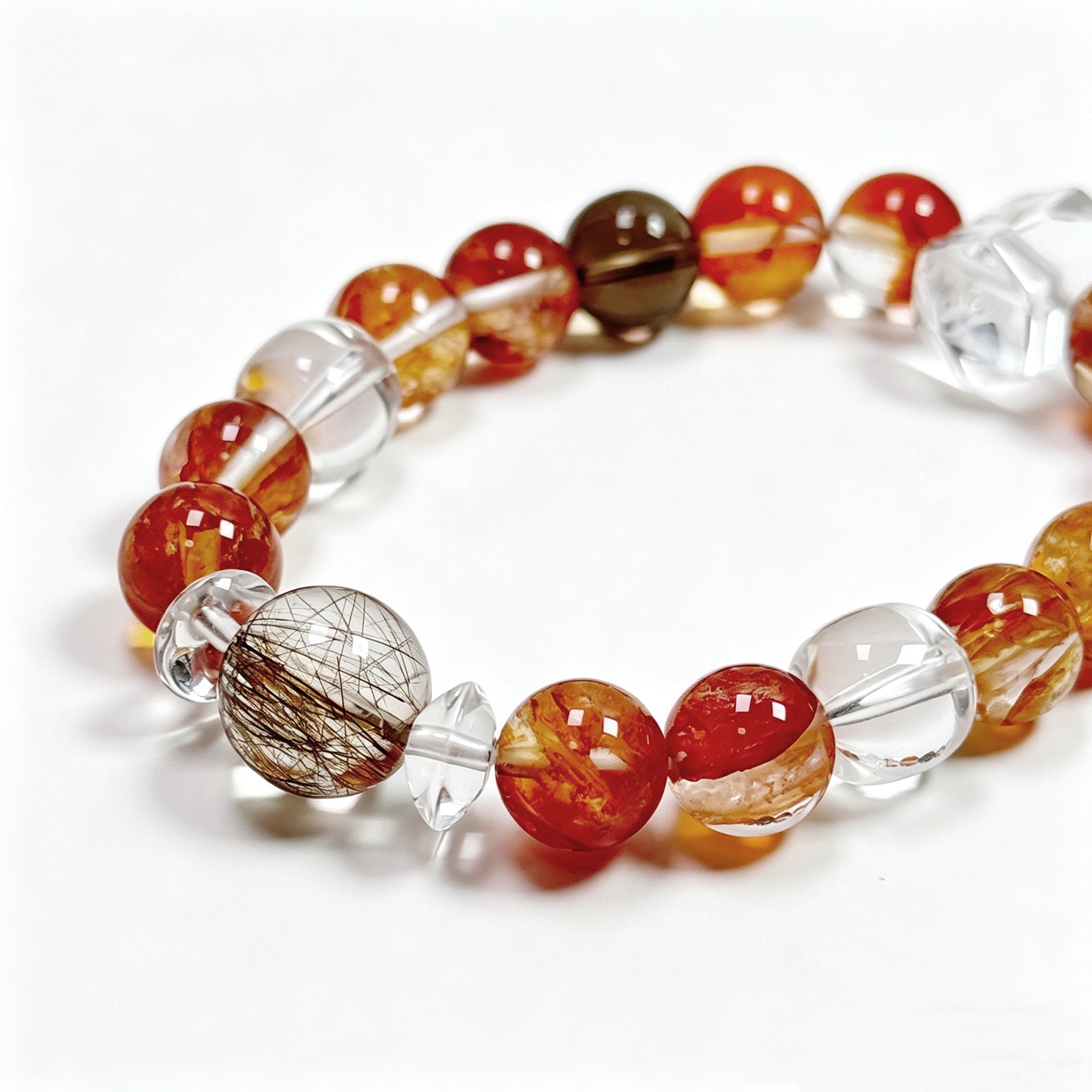 Close-up detail of Red Flower Quartz crystal bracelet showing natural stone texture