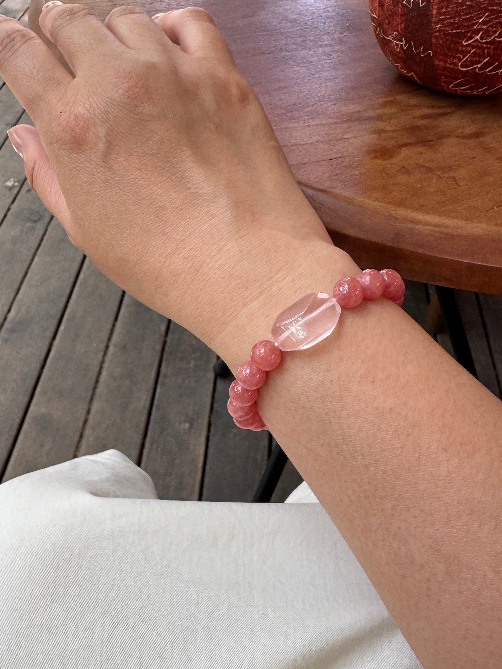 Rhodochrosite crystal bracelet worn on wrist close-up for love and emotional connection
