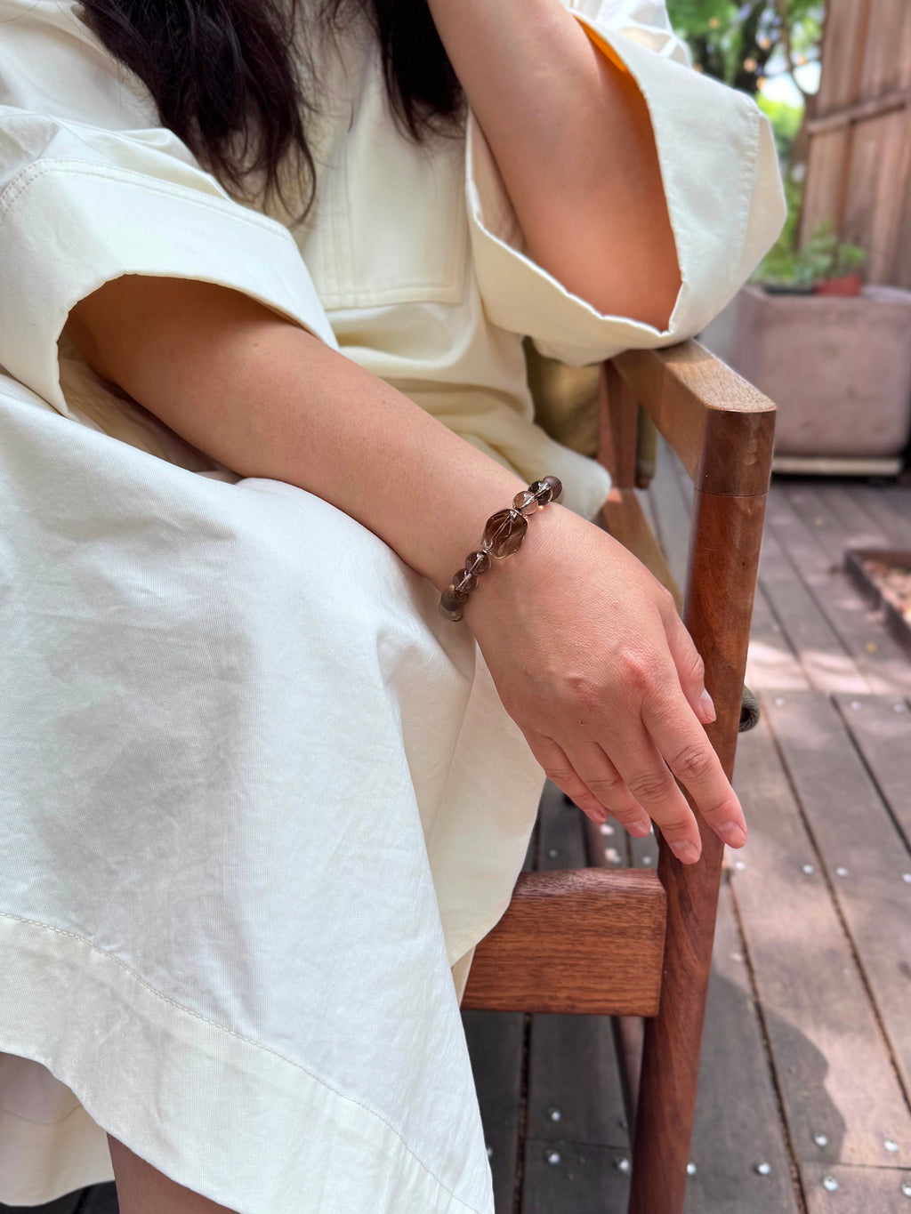 Smoky Quartz bracelet worn in a relaxed lifestyle setting for protection and grounded energy