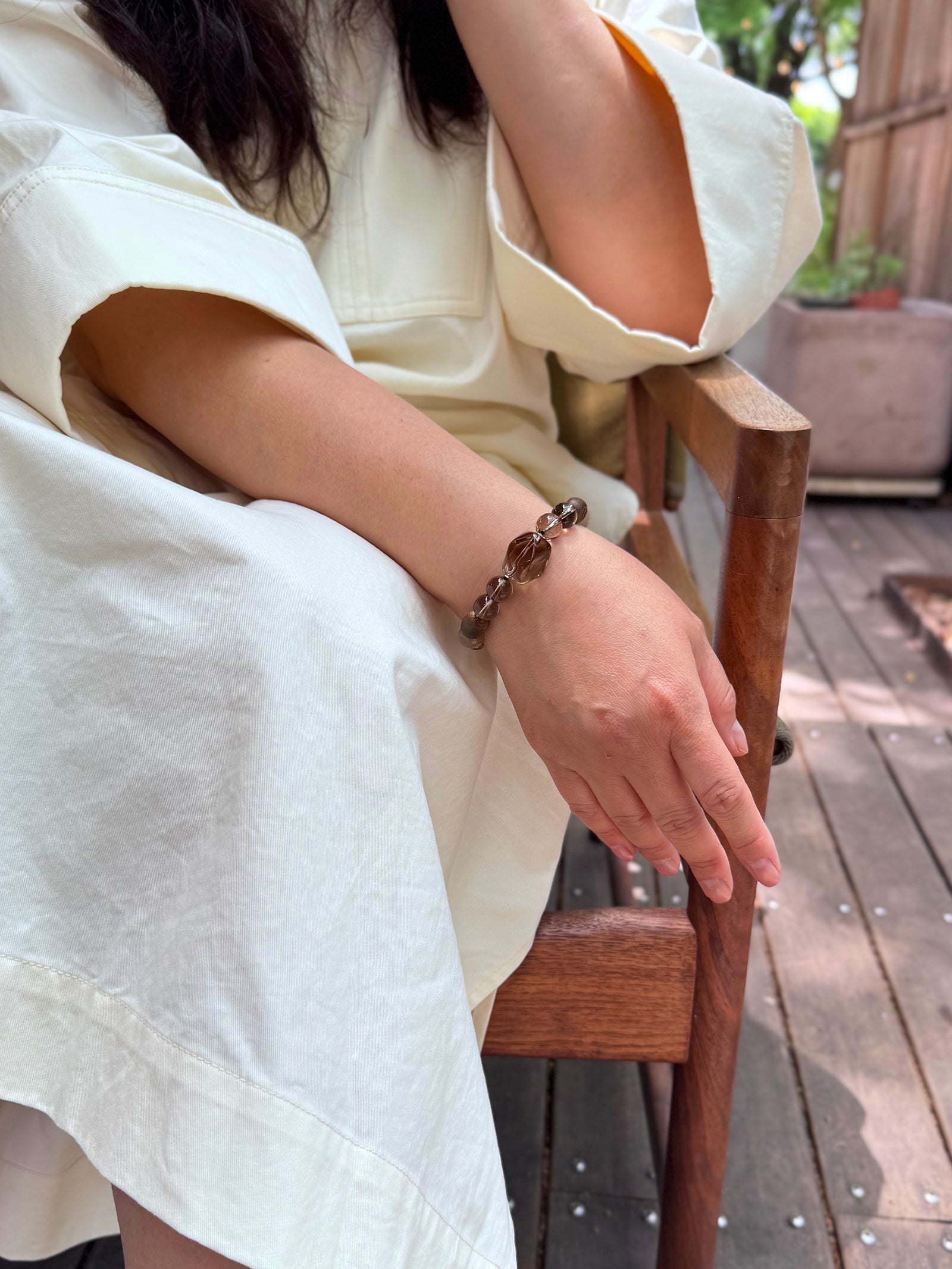 Smoky Quartz bracelet worn in a relaxed lifestyle setting for protection and grounded energy