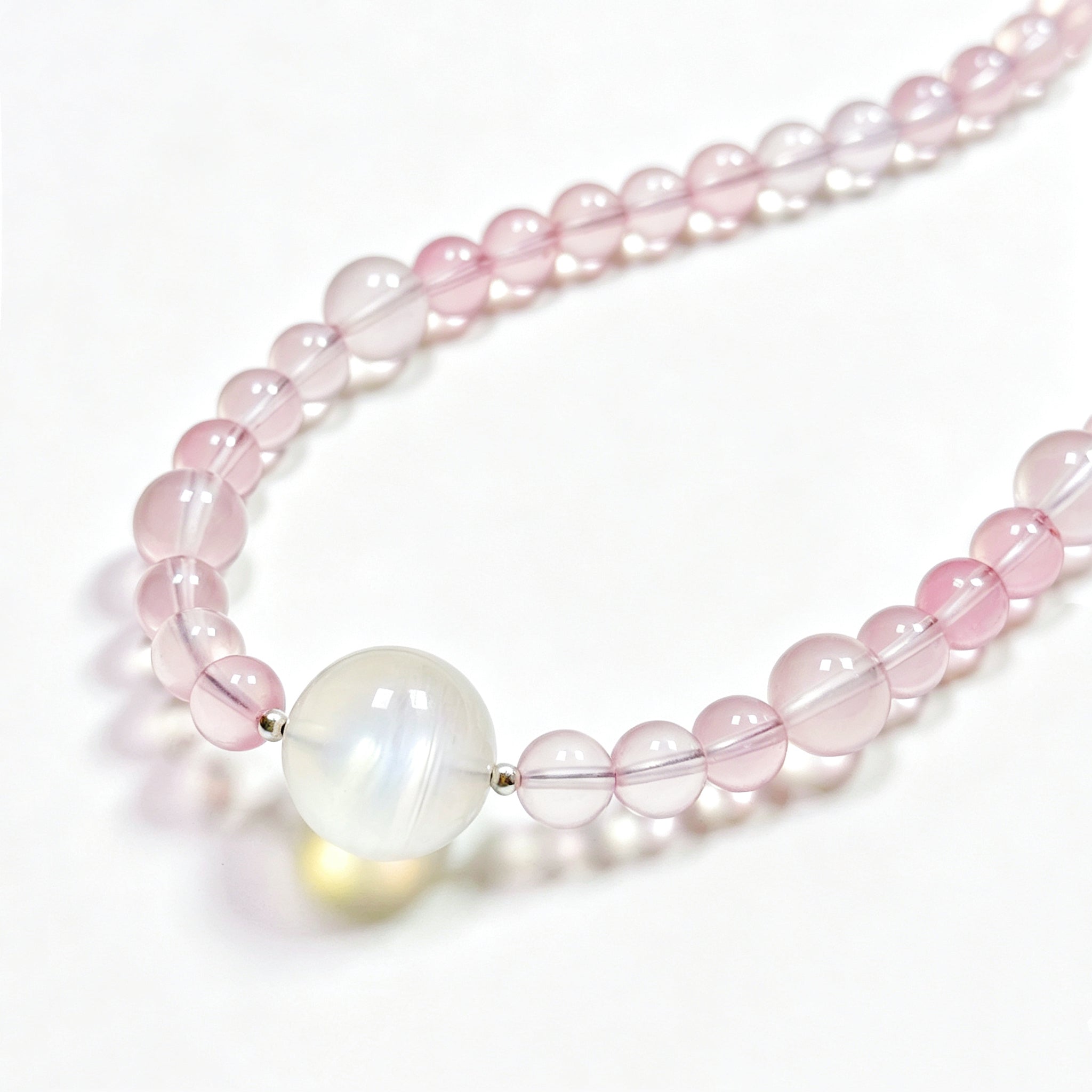 Close-up detail of Star rose quartz crystal necklace showing natural stone texture for self-love and gentle emotional healing
