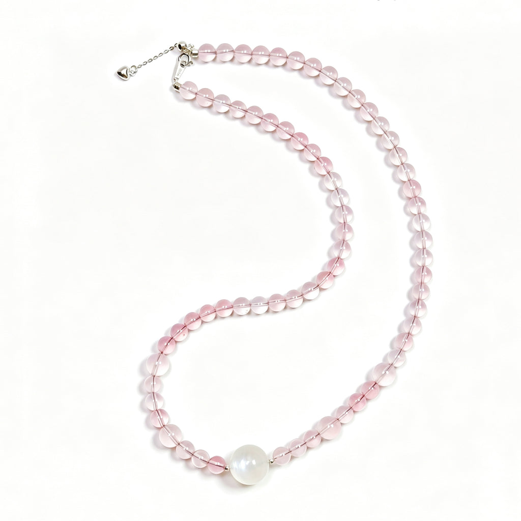 Top view of rose quartz crystal necklace showing full bead arrangement for love and emotional connection
