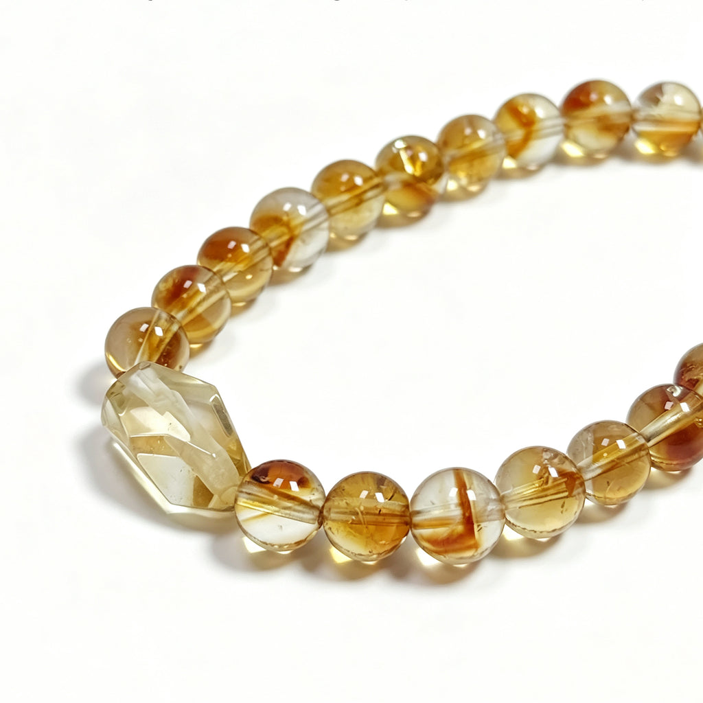 Close-up detail of Golden healer Quartz crystal bracelet showing natural stone texture