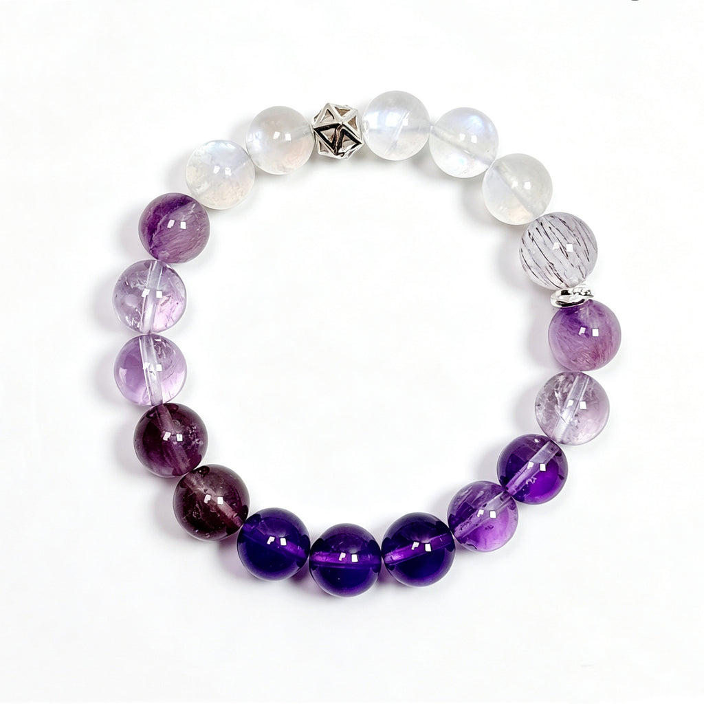 Top view of amethyst, purple titanium quartz, and moonstone bracelet showing full bead arrangement for inner clarity