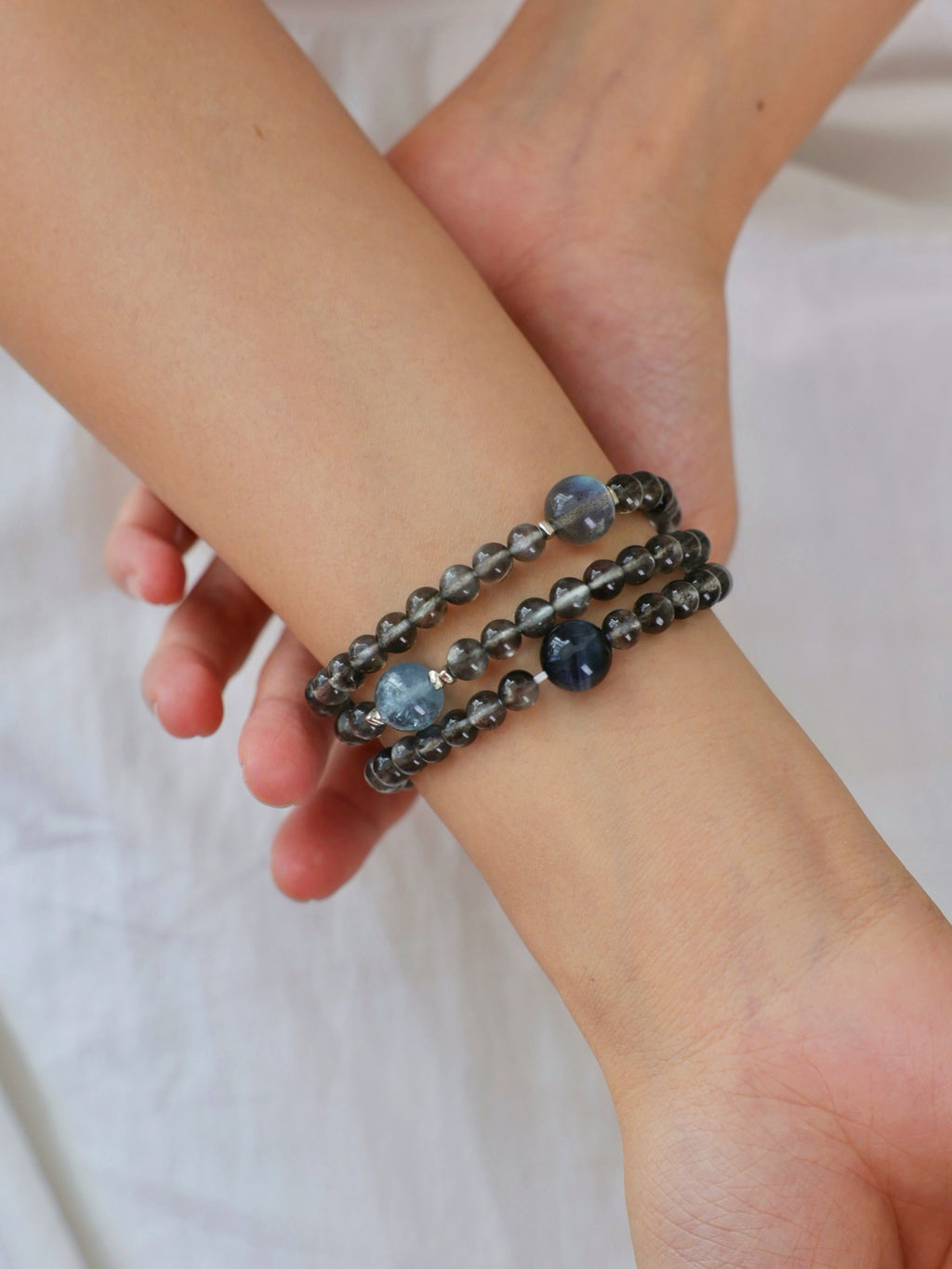 Aquamarine with Biotite, Black Tourmaline and Labradorite bracelet worn on wrist