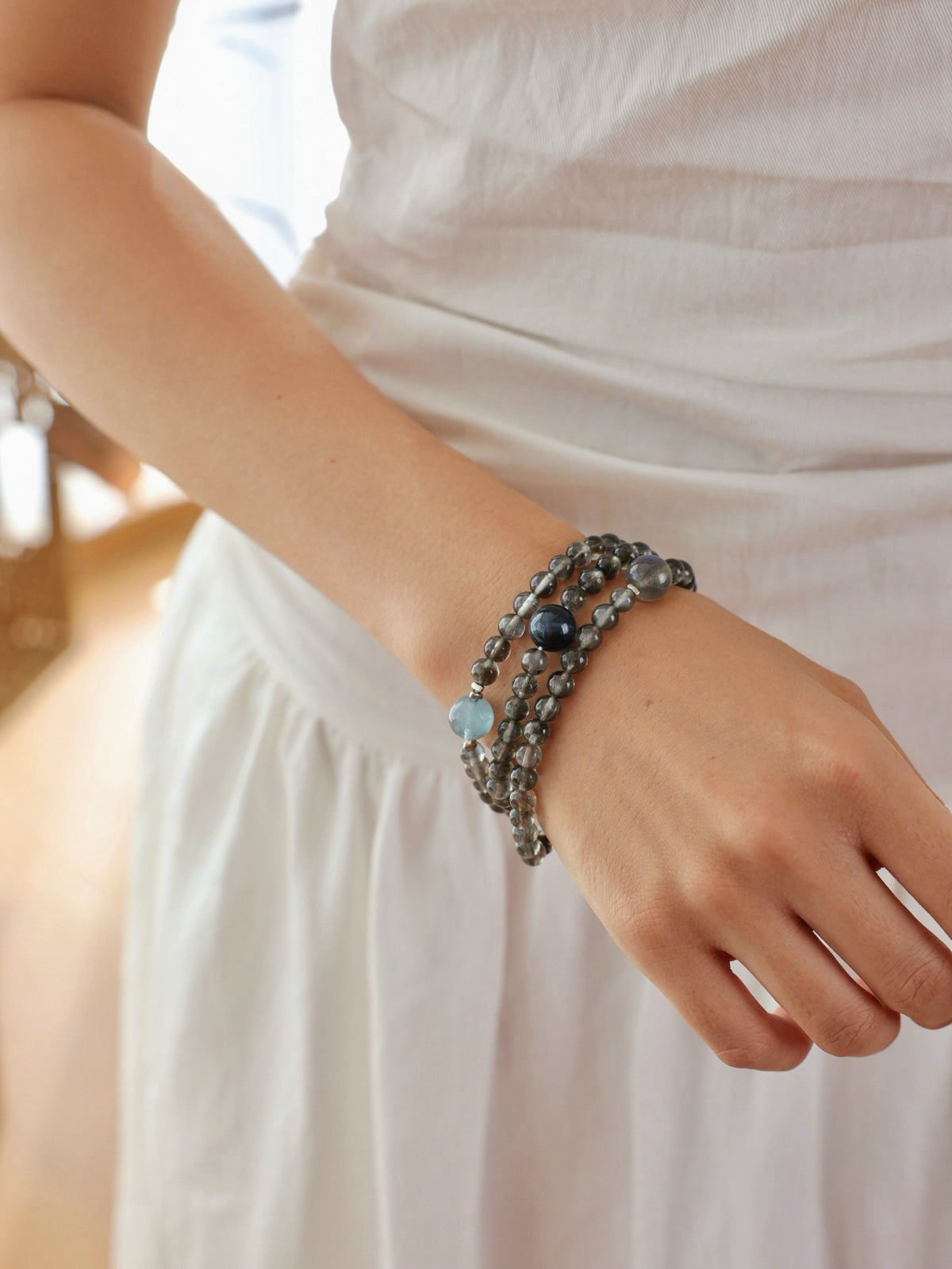 Aquamarine with Biotite, Black Tourmaline and Labradorite bracelet worn on wrist