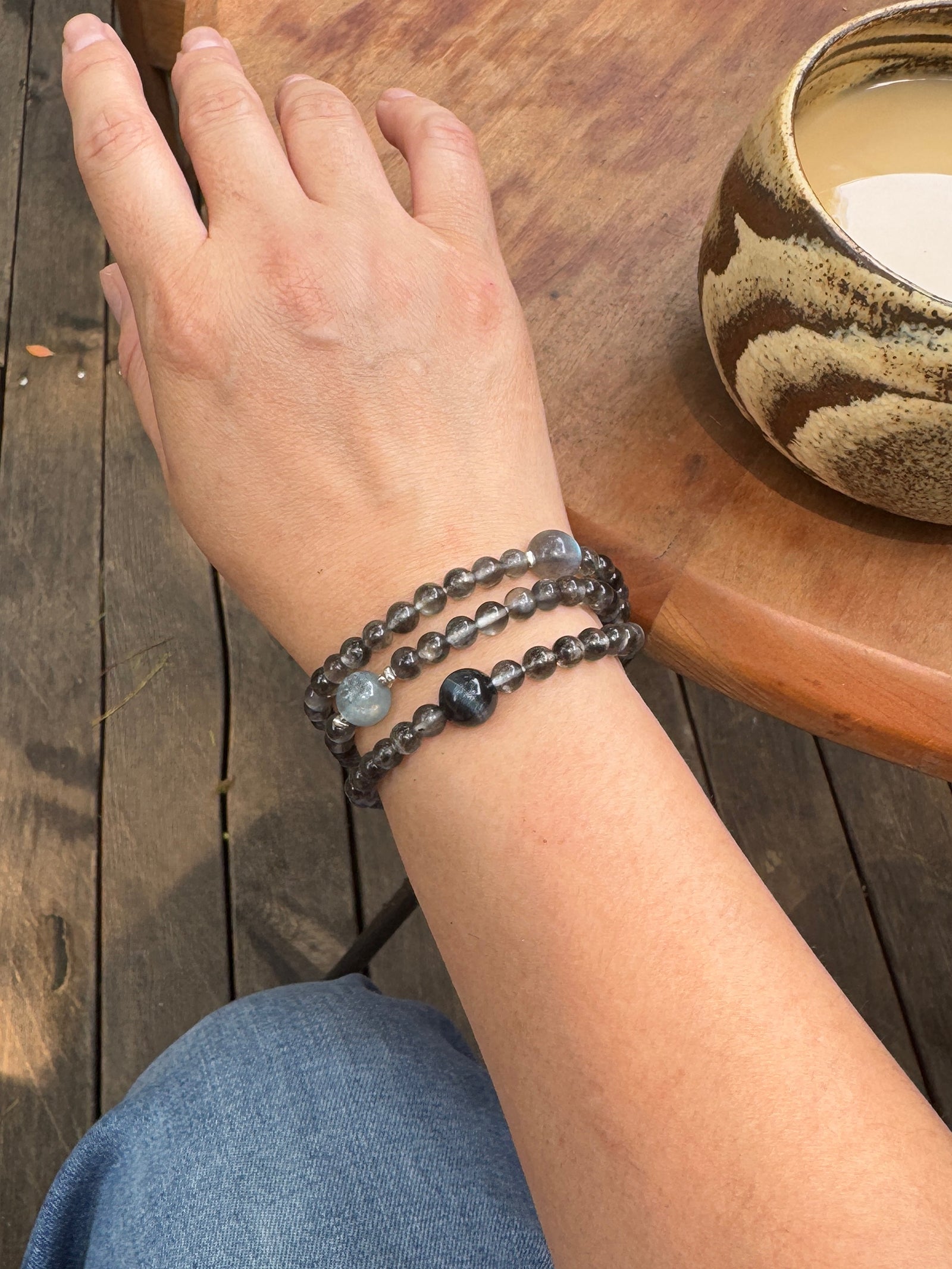 Aquamarine and Biotite crystal bracelet worn on wrist showing size and fit