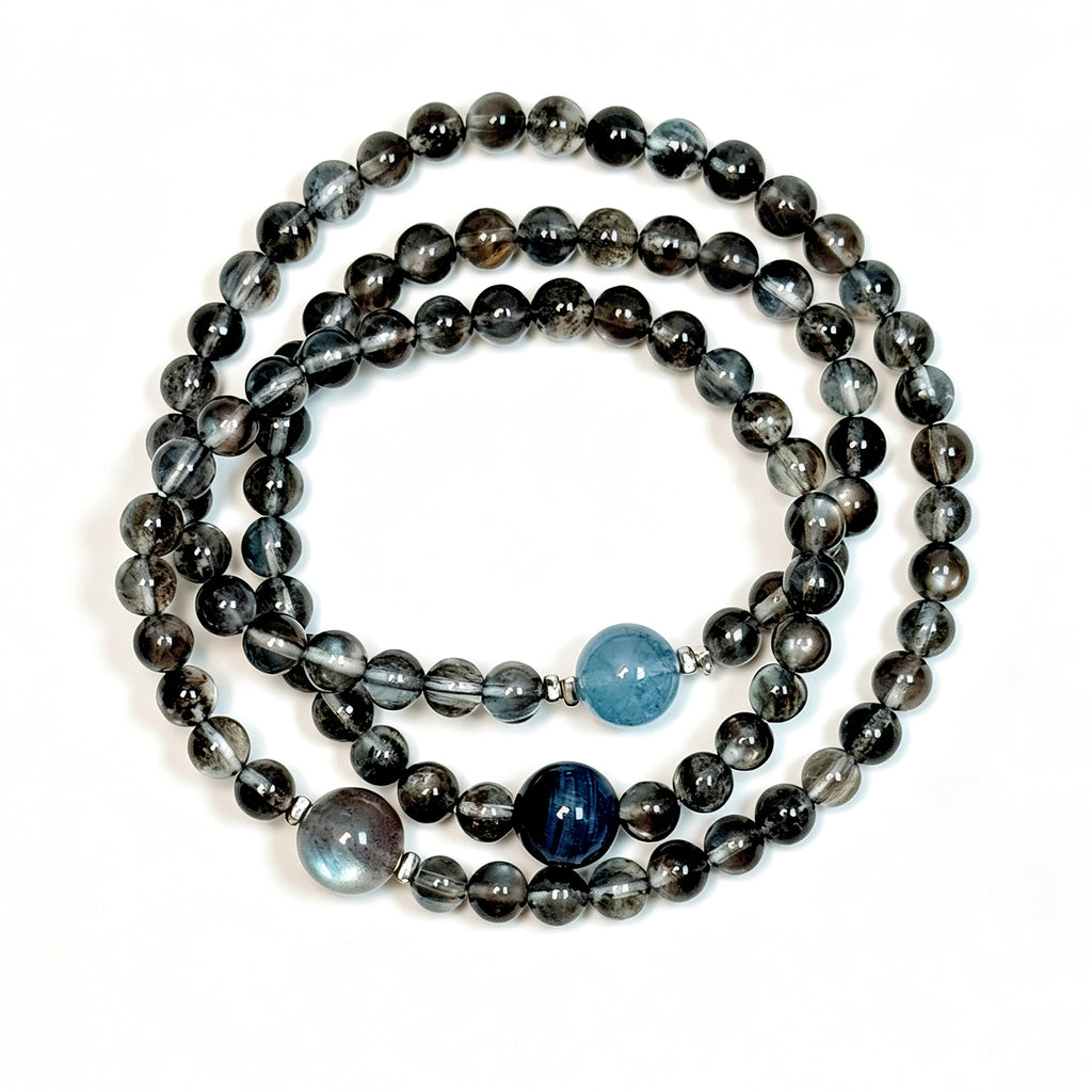 Top view of Aquamarine and Biotite crystal bracelet with Blue Tiger's Eye and Labradorite