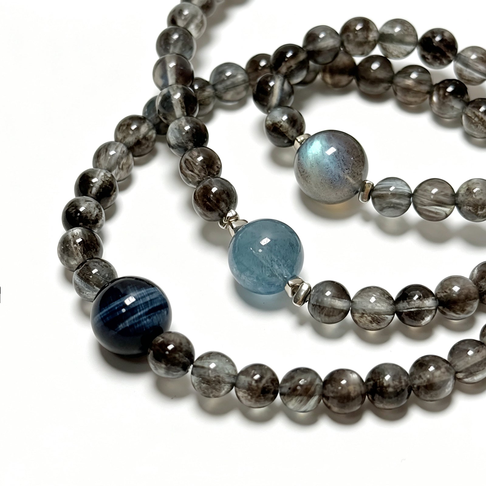 Close-up detail of Aquamarine and Biotite crystal bracelet showing natural crystal texture
