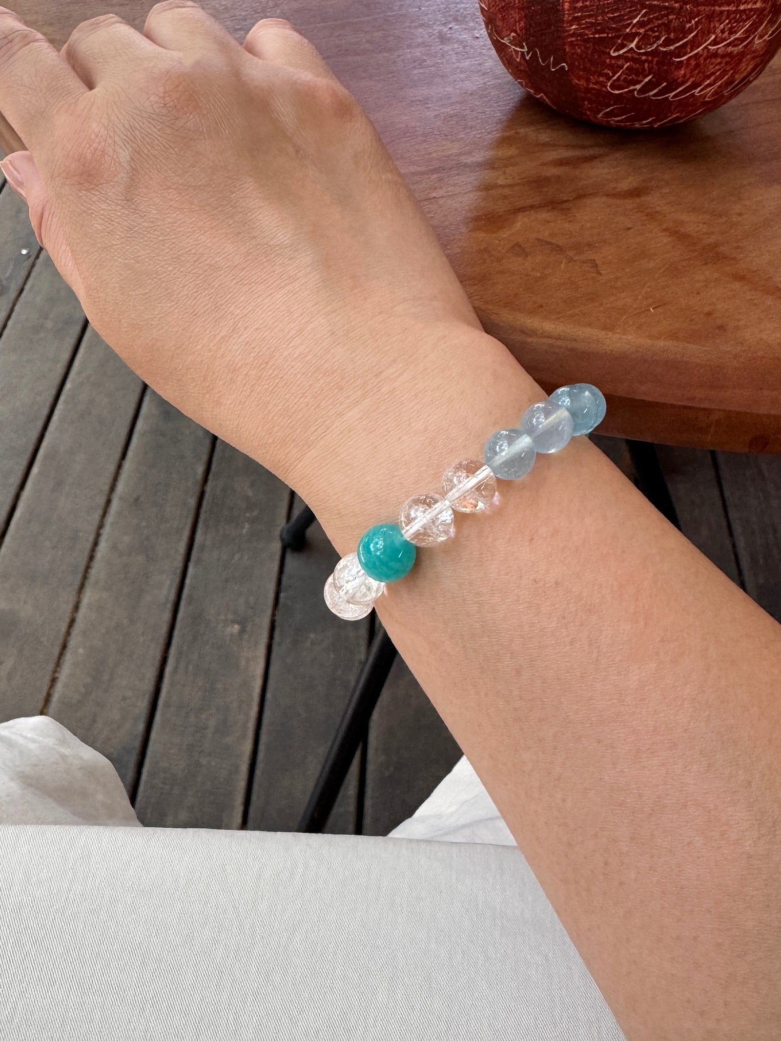 Aquamarine, Clear Quartz crystal bracelet worn on wrist close-up showing natural texture and fit