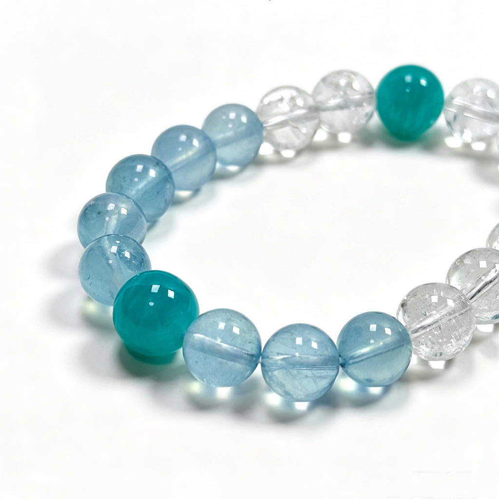 Close-up detail of Clear Quartz crystal bracelet showing natural rainbow inclusions and ice-like textures