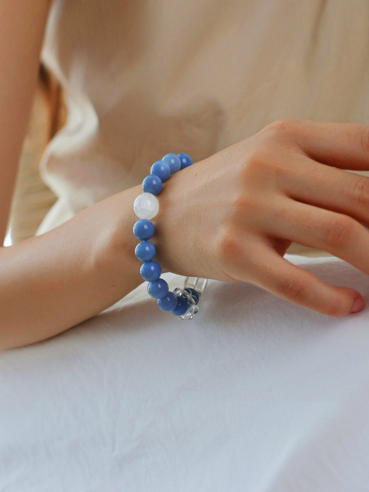 Baby Blue Australian Opal, White Phantom and Clear Quartz bracelet worn on wrist