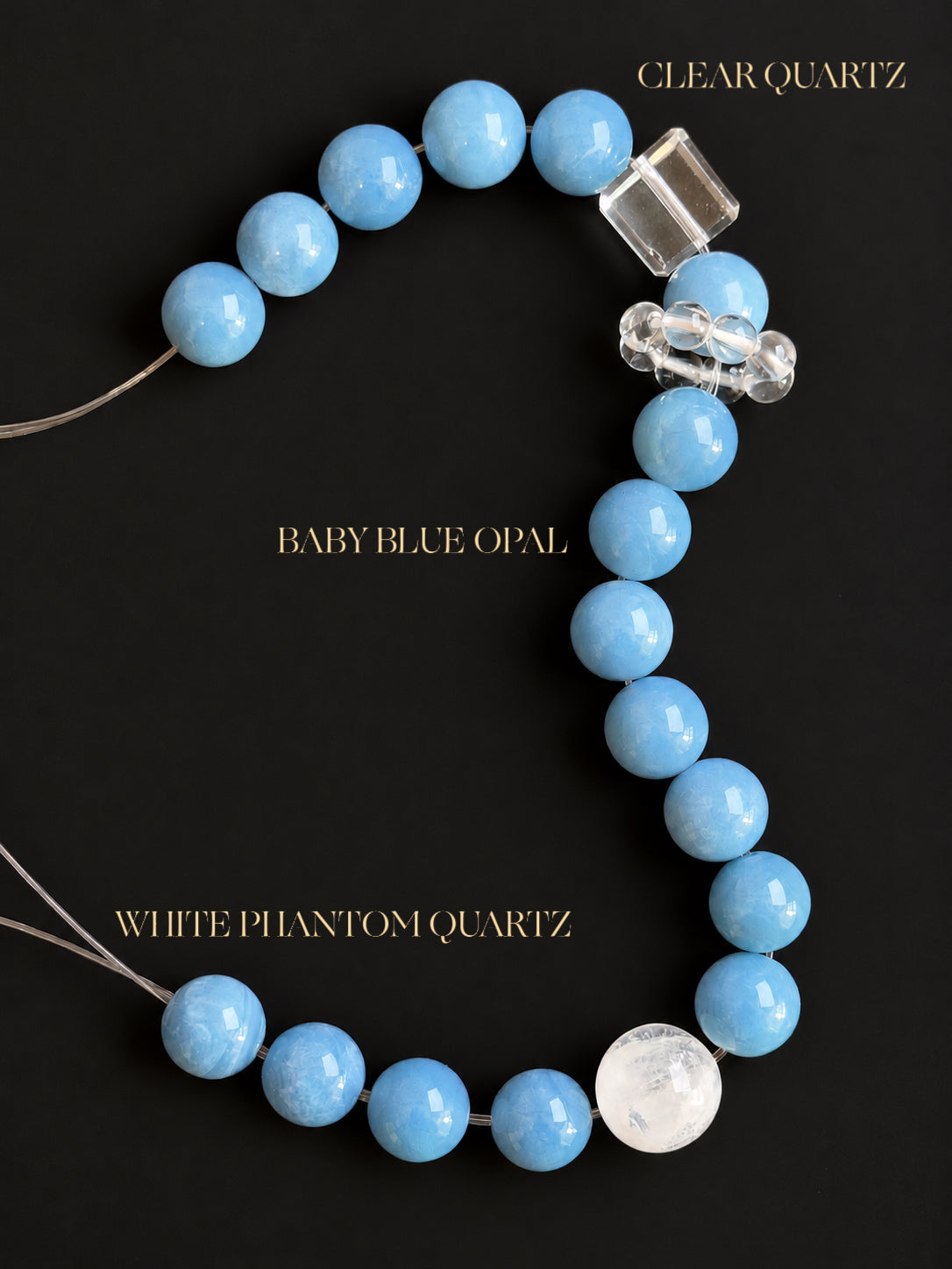 Natural Baby Blue Australian Opal, White Phantom Quartz and Clear Quartz bracelet displayed on a black background, highlighting the soft blue gemstone tones, natural mineral textures and crystal clarity.