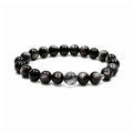 Black obsidian and black rutilated quartz bracelet on clean white background