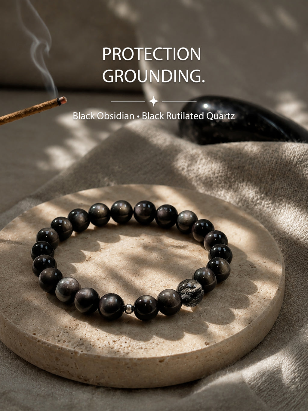 Black obsidian and black rutilated quartz bracelet styled in a calm grounding setting