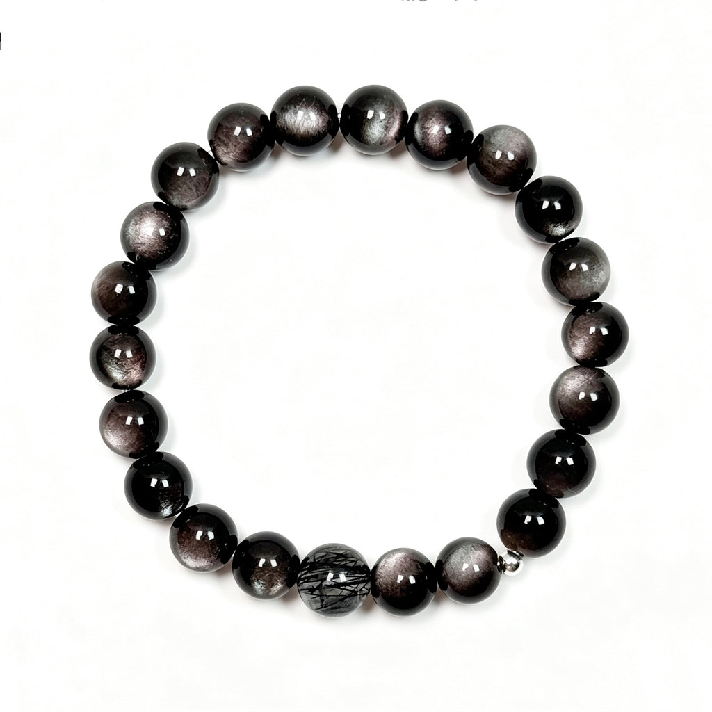 op view of black obsidian and black rutilated quartz bracelet showing full bead arrangement