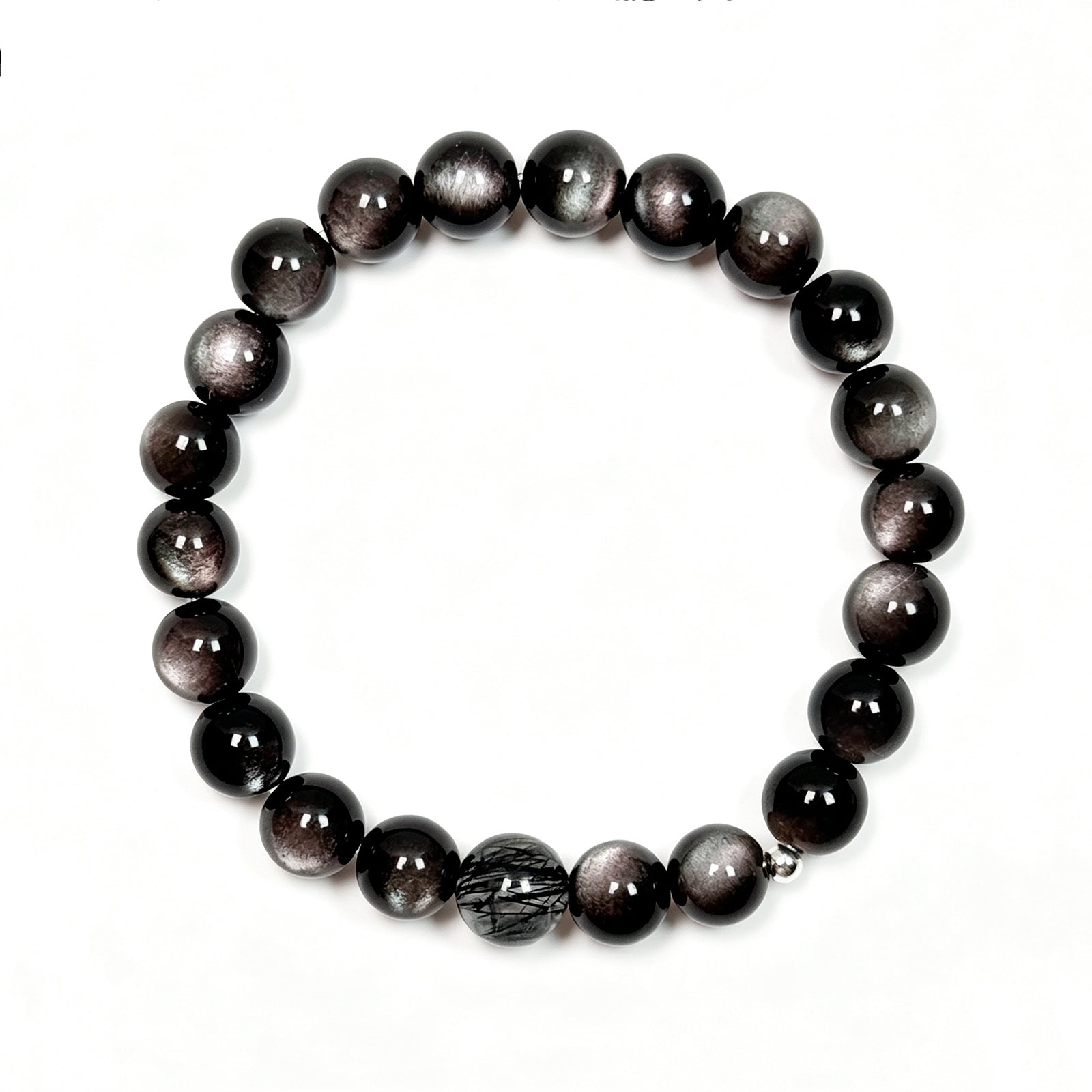 op view of black obsidian and black rutilated quartz bracelet showing full bead arrangement