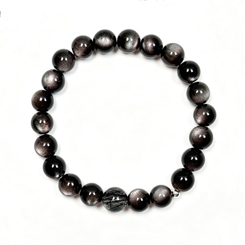 op view of black obsidian and black rutilated quartz bracelet showing full bead arrangement