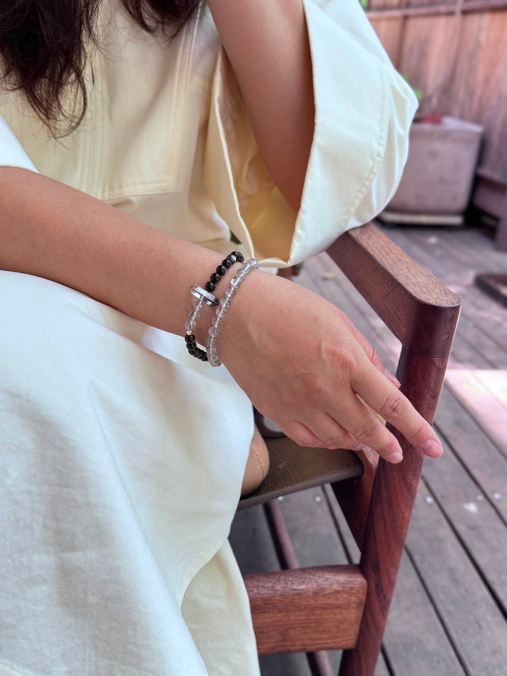 Black rutilated quartz and obsidian double wrap bracelet on wrist