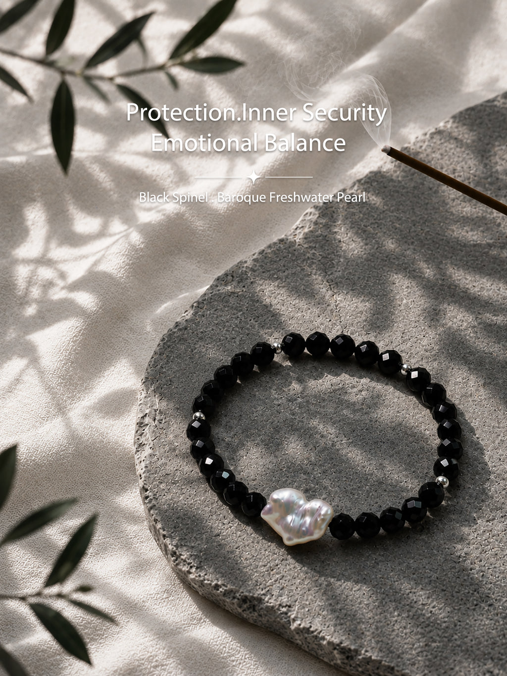 Black spinel and natural baroque pearl bracelet styled in a natural lifestyle setting