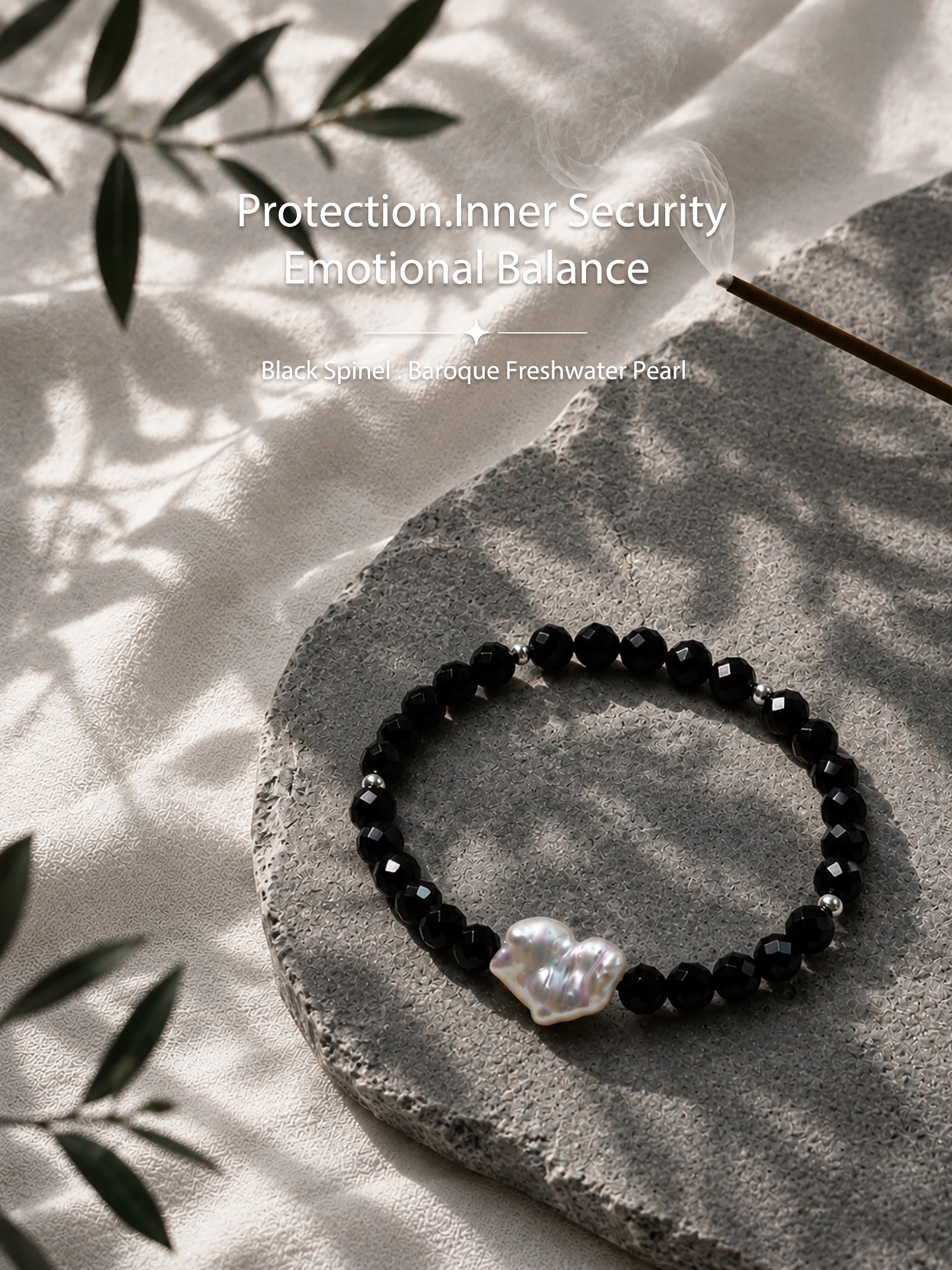 Black spinel and natural baroque pearl bracelet styled in a natural lifestyle setting