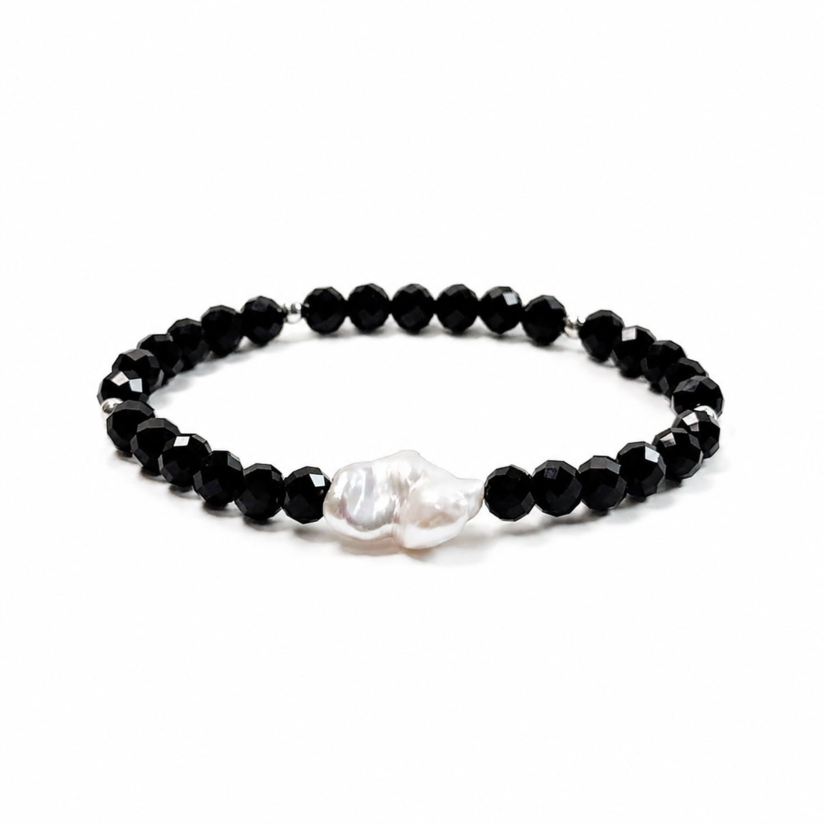 Black spinel and natural baroque pearl bracelet with 925 sterling silver beads, side view