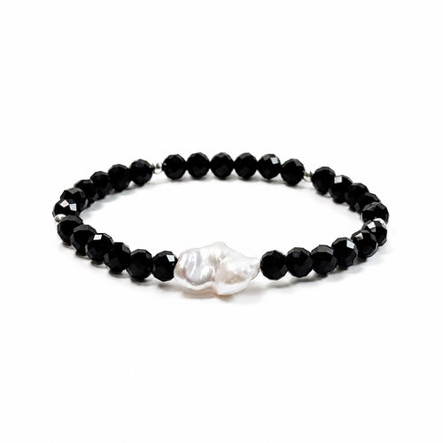 Black spinel and natural baroque pearl bracelet with 925 sterling silver beads, side view