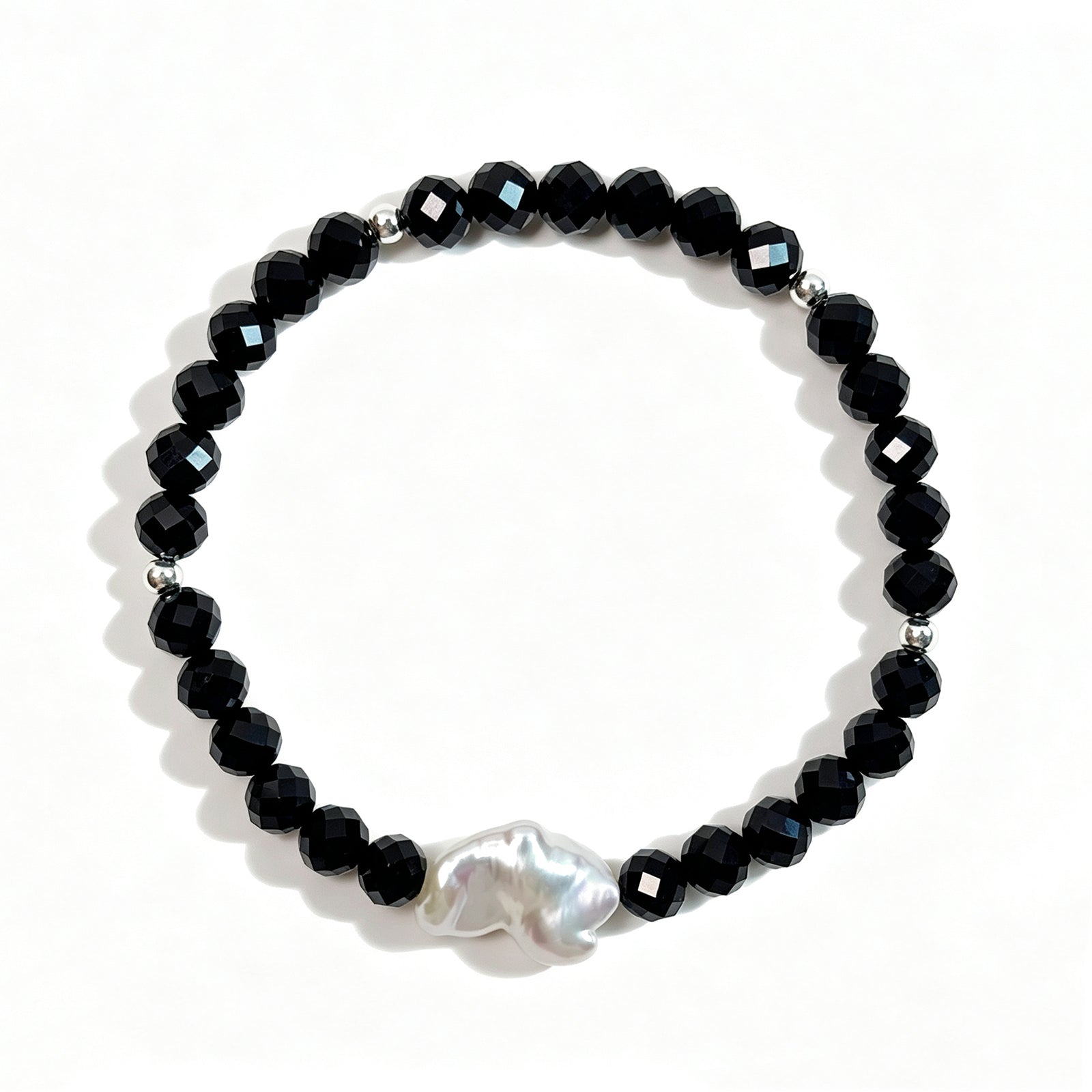 Black spinel and natural baroque pearl bracelet with 925 sterling silver beads, top view