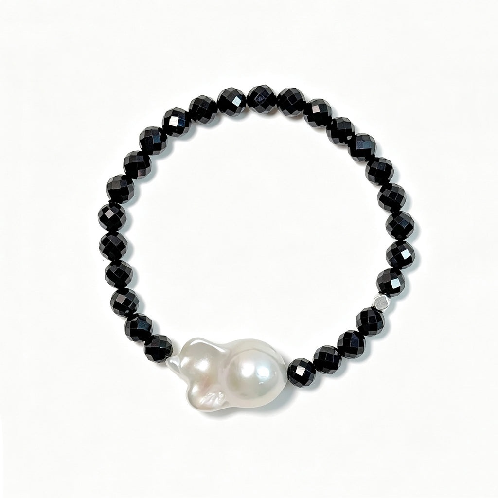 Black spinel and baroque freshwater pearl bracelet viewed from above