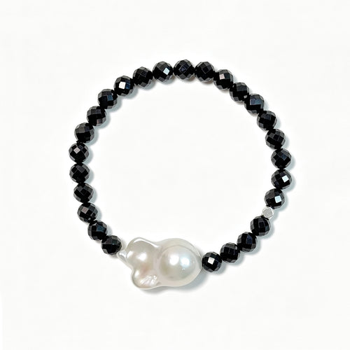 Black spinel and baroque freshwater pearl bracelet viewed from above