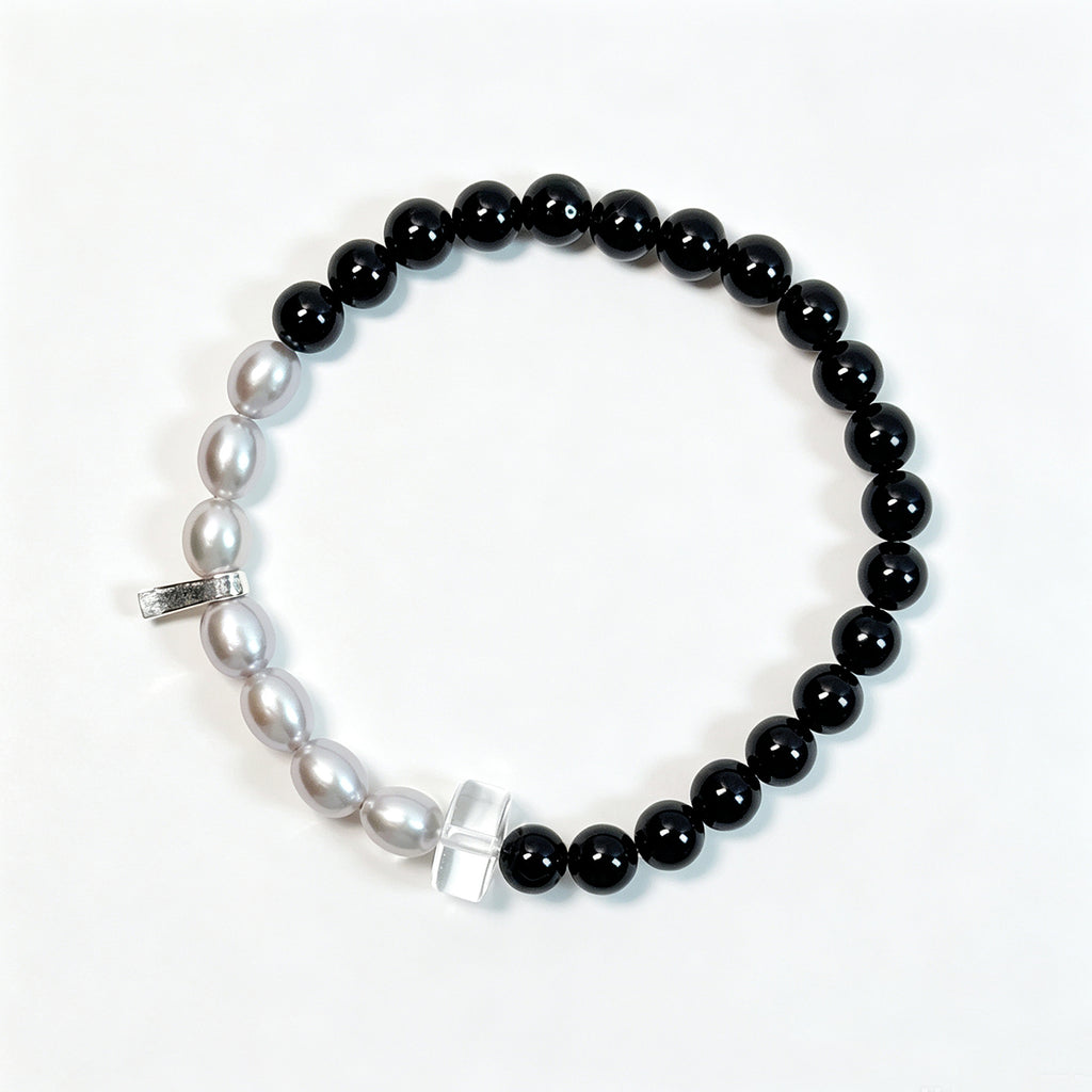 Black tourmaline and gray freshwater pearl bracelet viewed from above