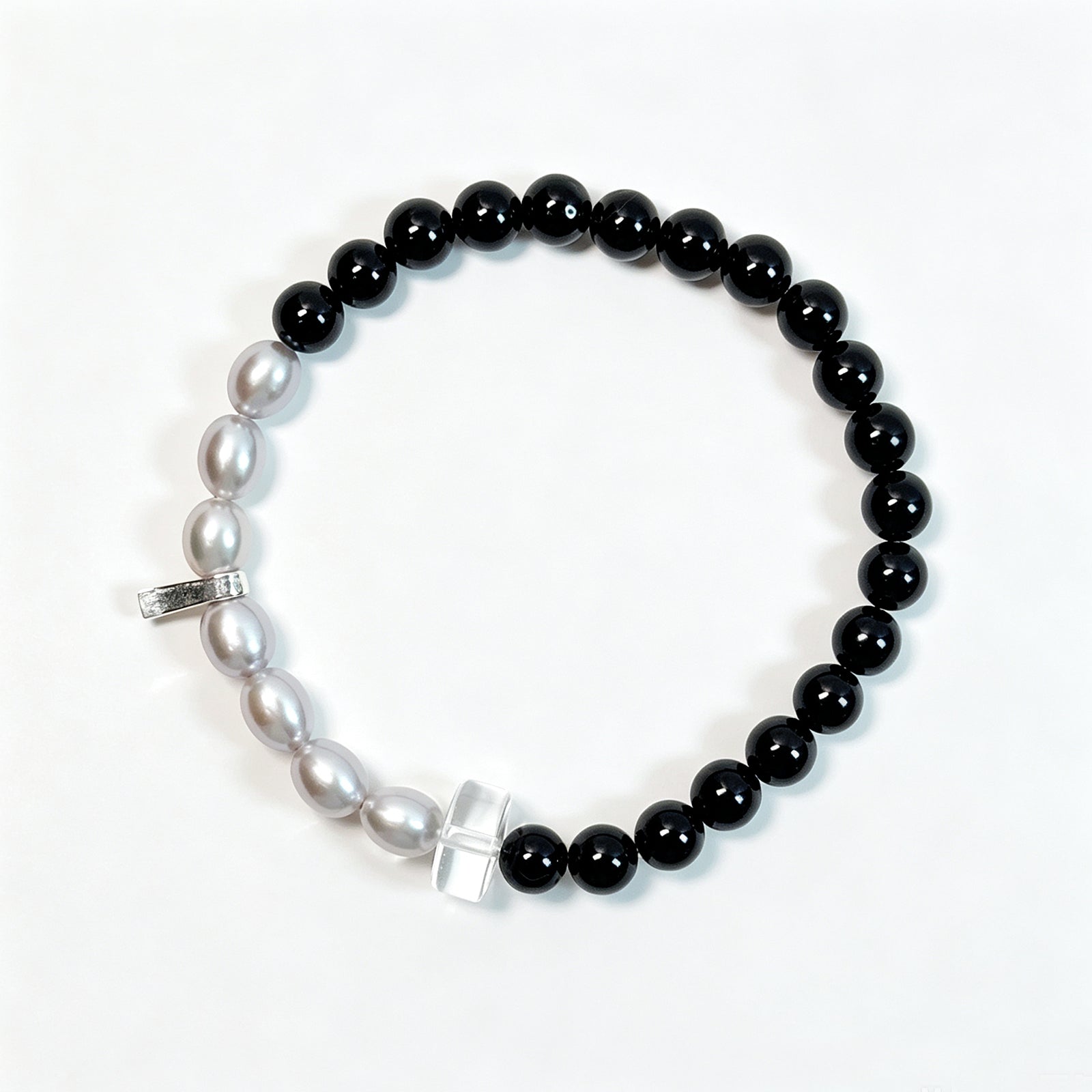 Black tourmaline and gray freshwater pearl bracelet viewed from above