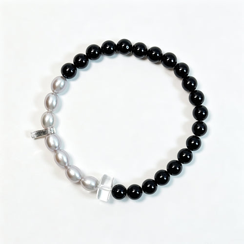 Black tourmaline and gray freshwater pearl bracelet viewed from above