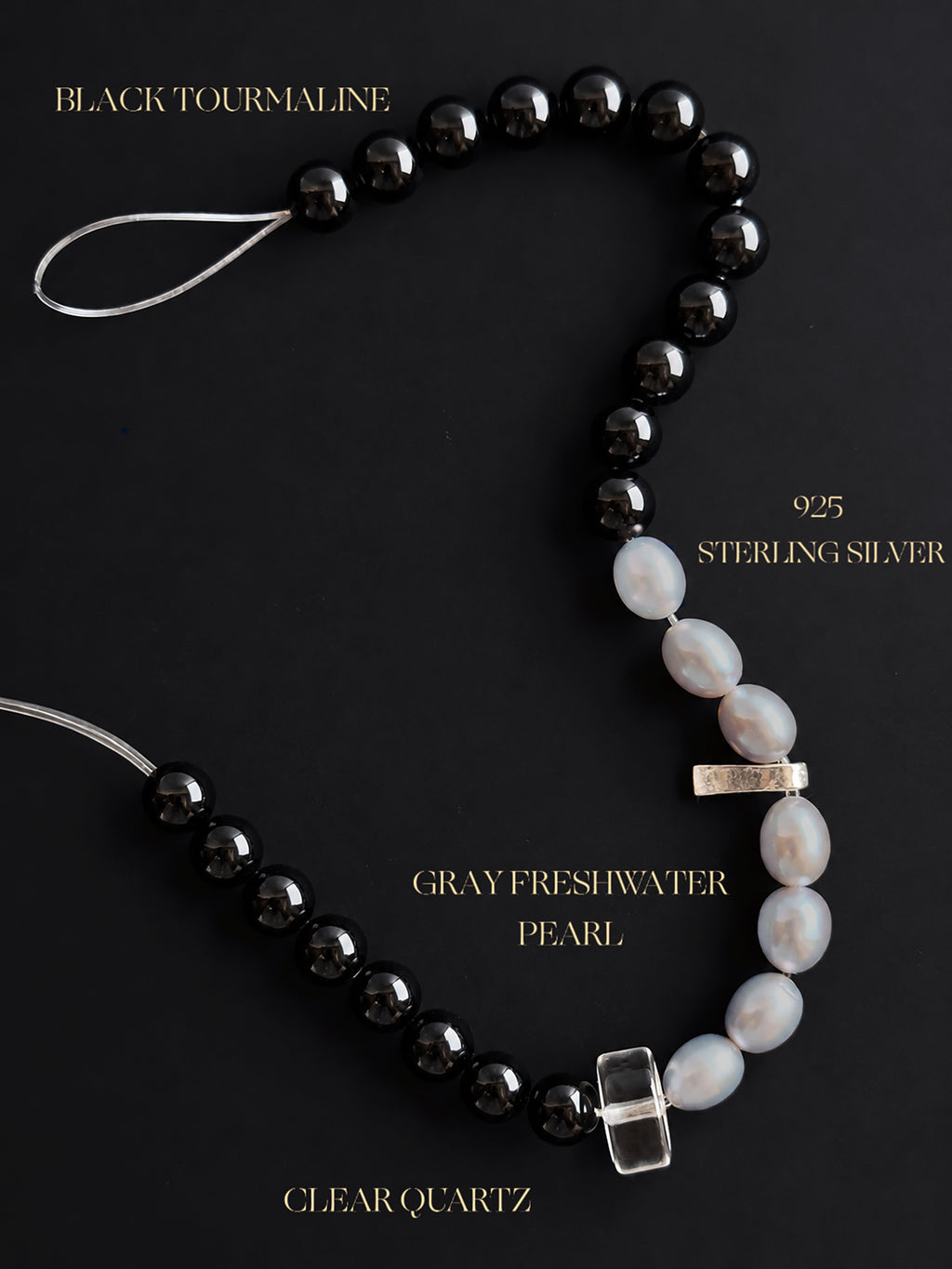 Natural undyed Black Tourmaline, lustrous Gray Freshwater Pearls and high-clarity Clear Quartz bracelet with 925 sterling silver accents, showcasing natural gemstone textures against a dark mineral background.