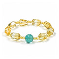 Side view of a citrine and blue-green fluorite crystal bracelet.