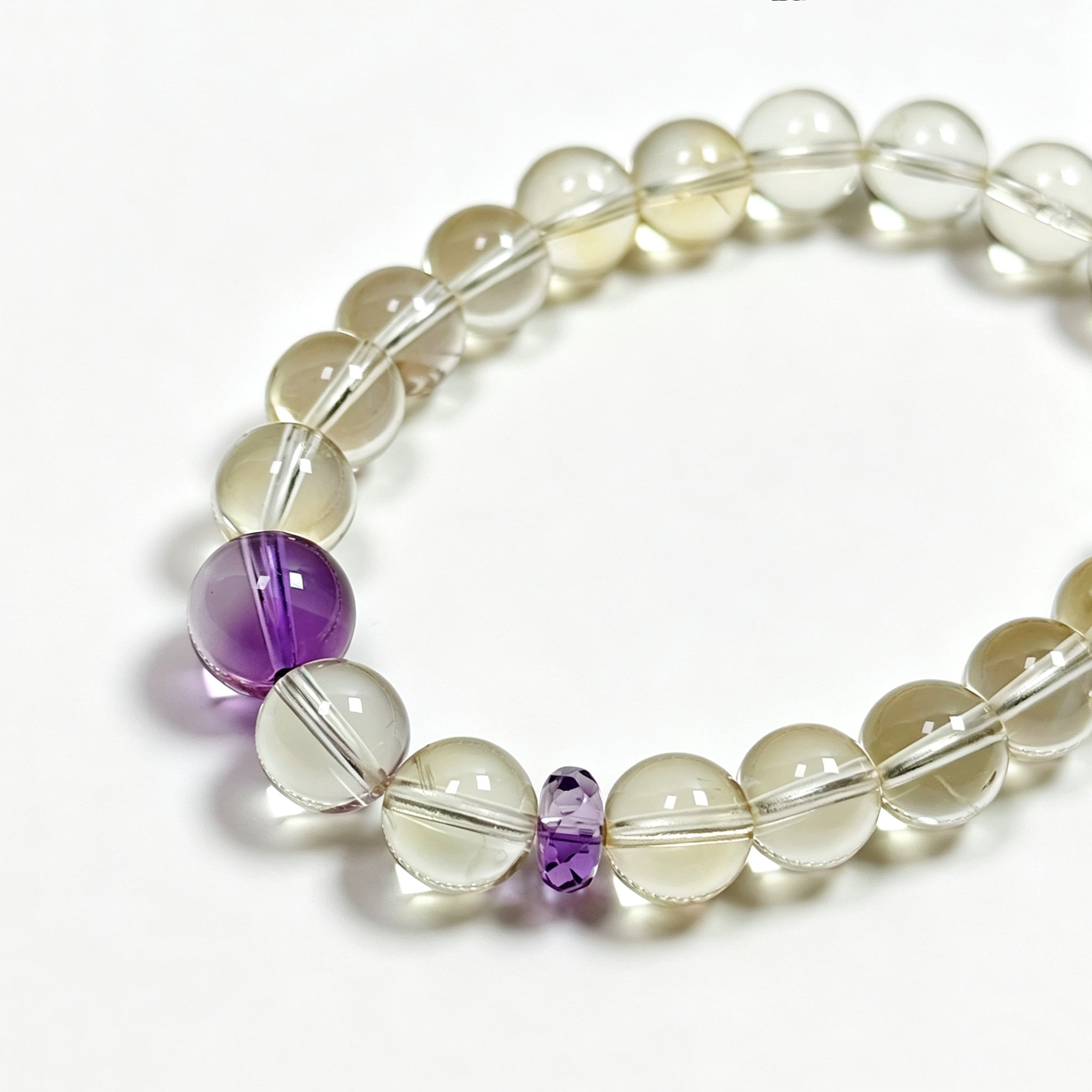 Close-up detail of citrine crystal bracelet showing natural stone texture