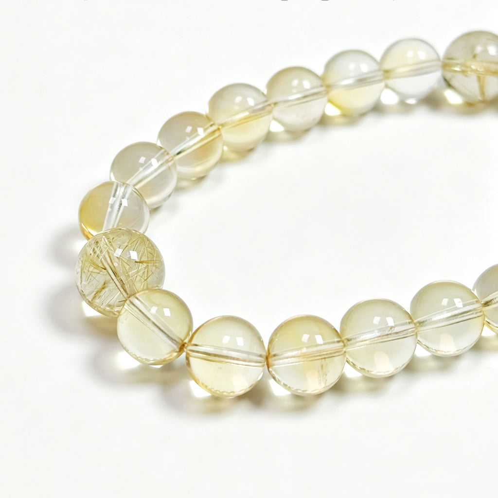 Close-up detail of citrine crystal bracelet showing natural stone texture