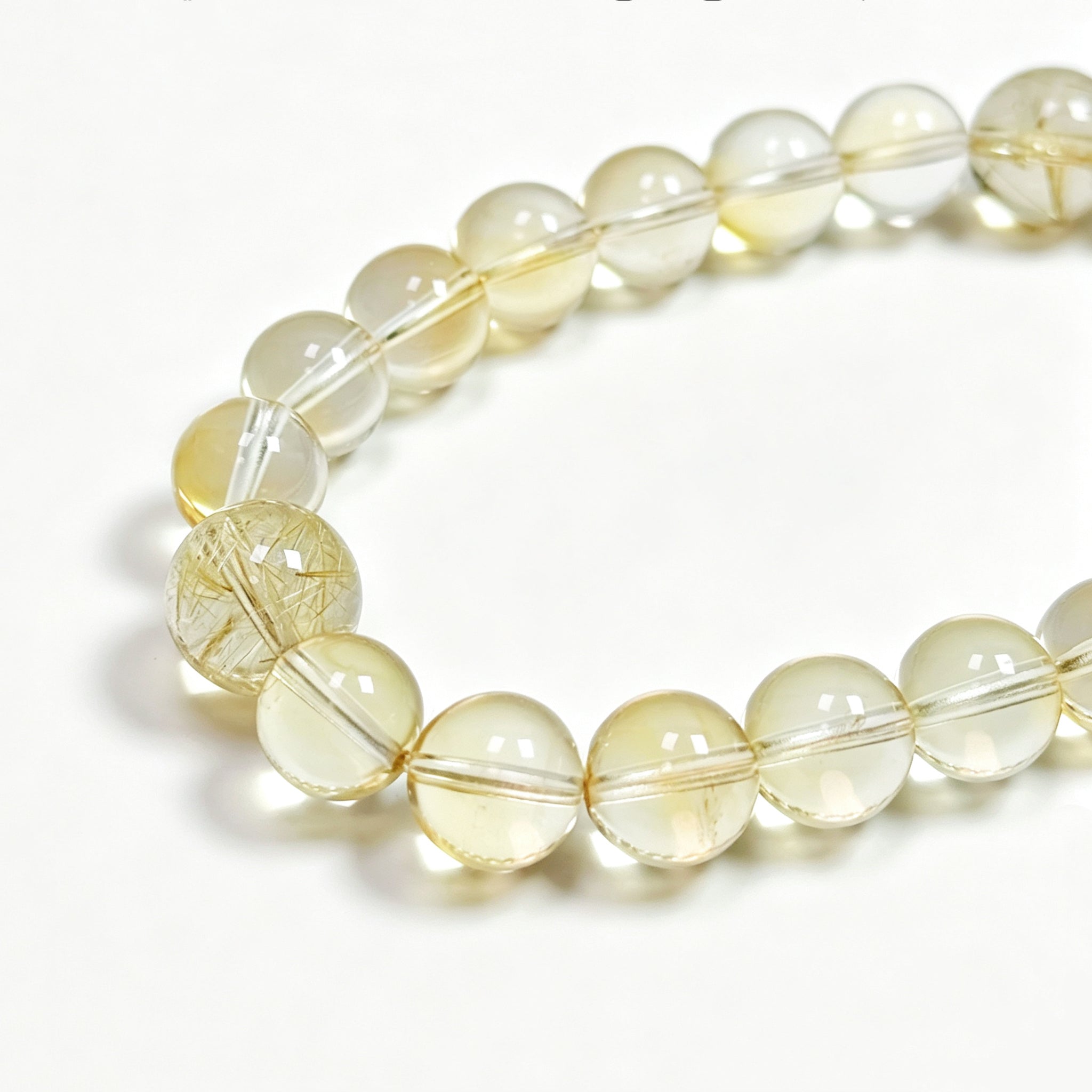 Close-up detail of citrine crystal bracelet showing natural stone texture