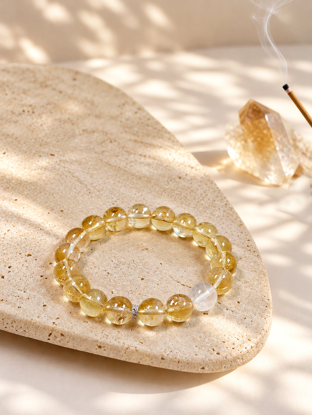 High-rainbow Citrine abundance bracelet styled on meditation altar with calming spiritual objects