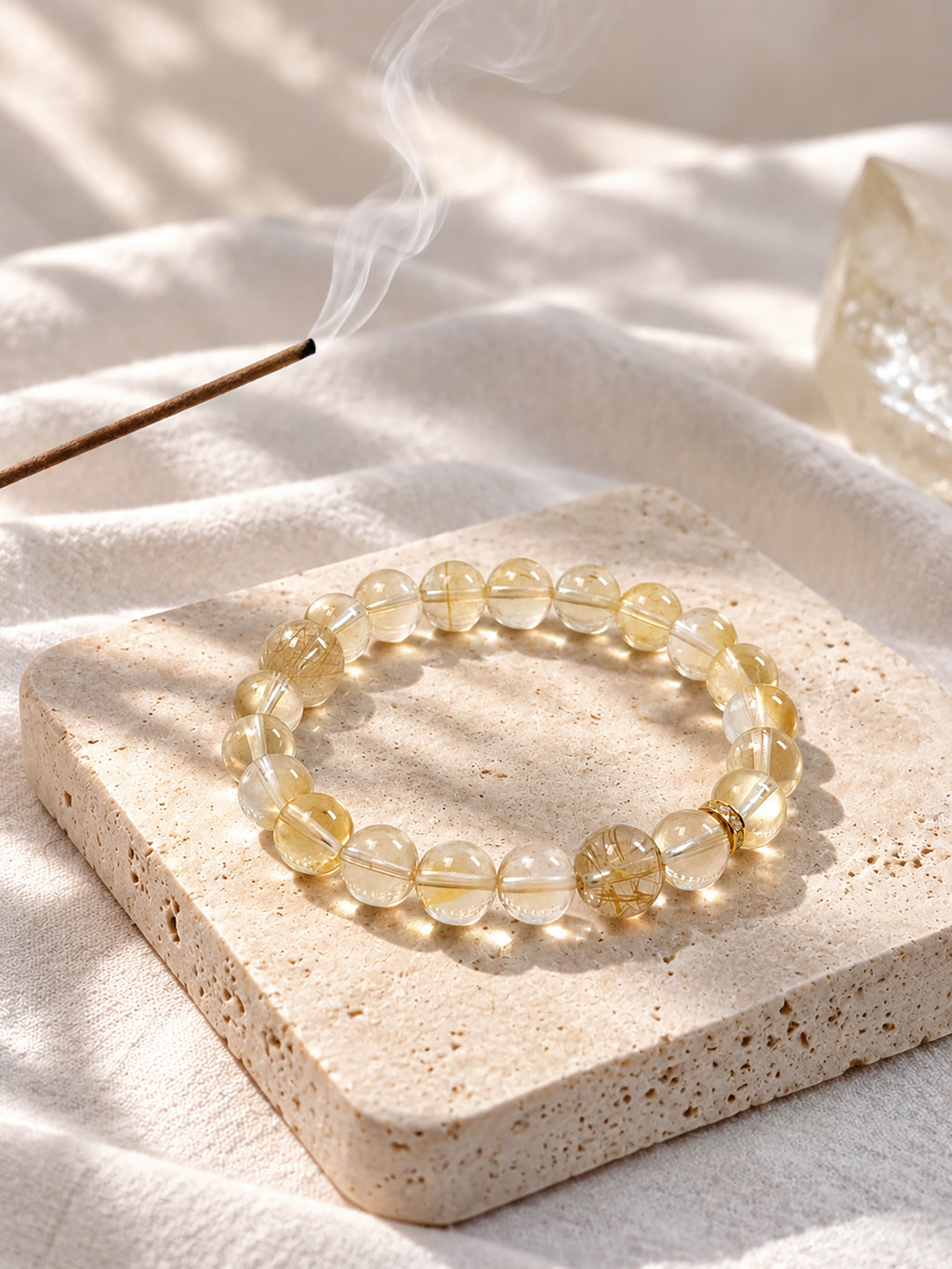 citrine bracelet styled on meditation altar with calming spiritual objects