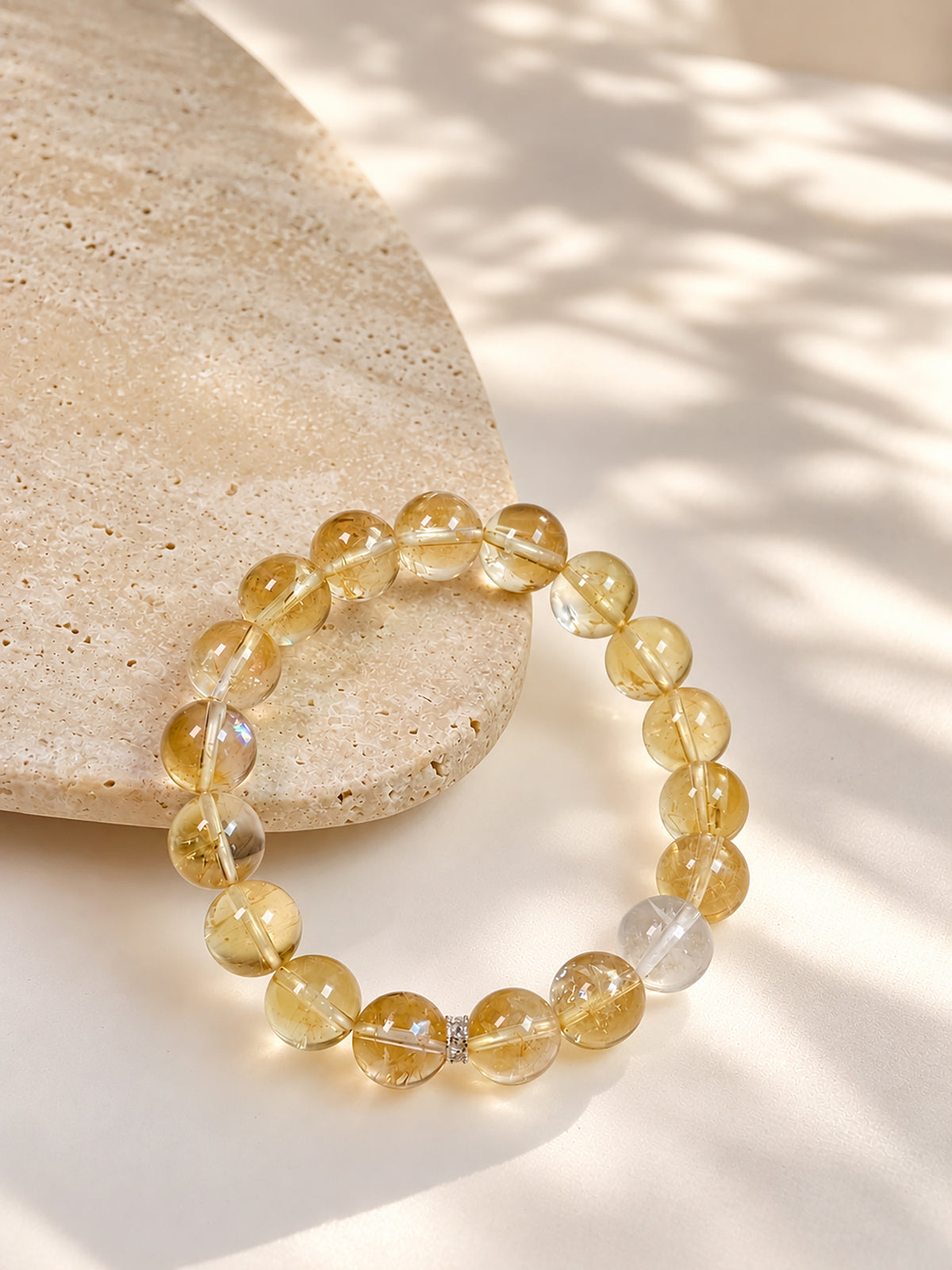 High-rainbow Citrine abundance bracelet styled on meditation altar with calming spiritual objects