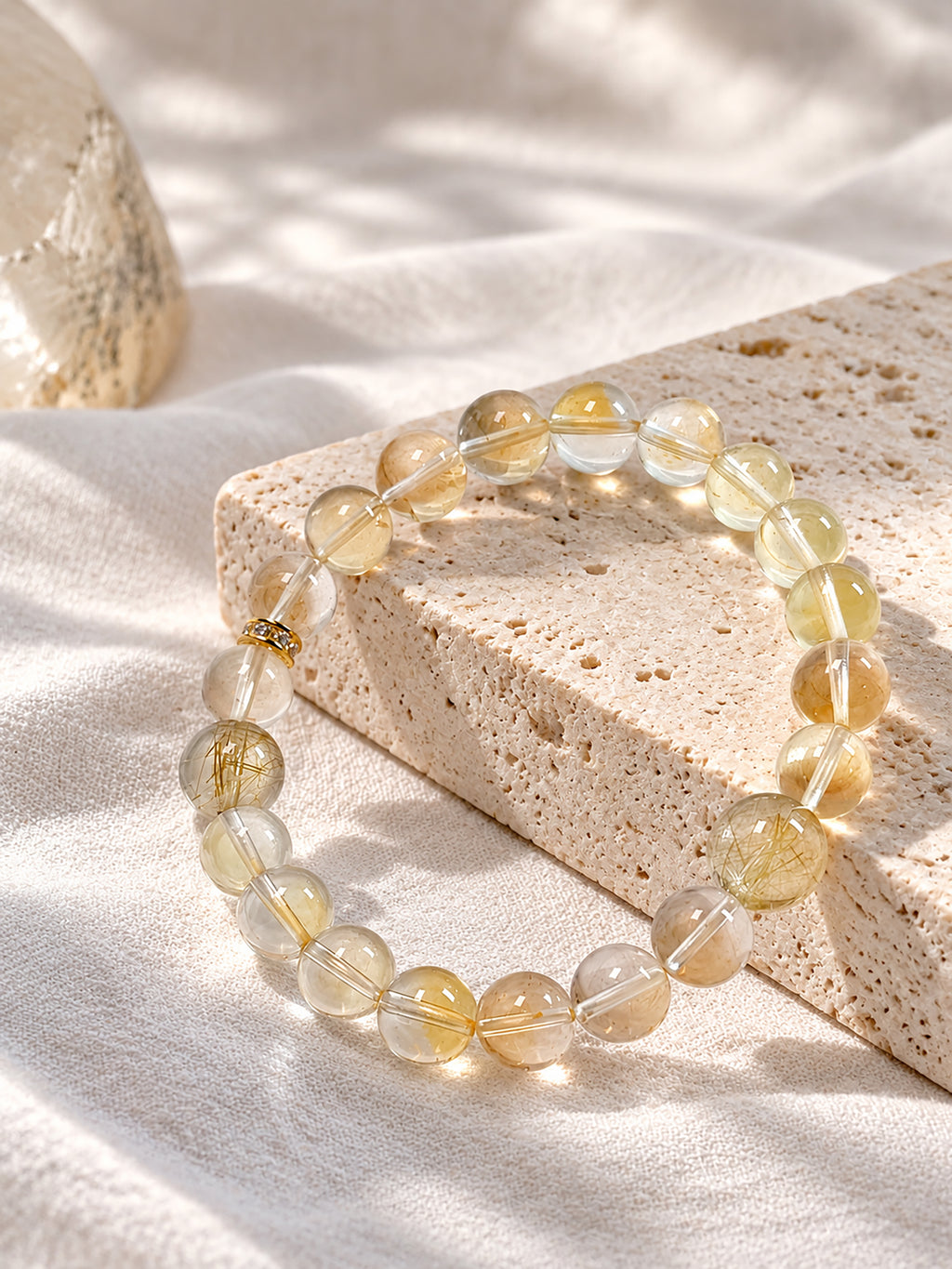 citrine bracelet styled on meditation altar with calming spiritual objects